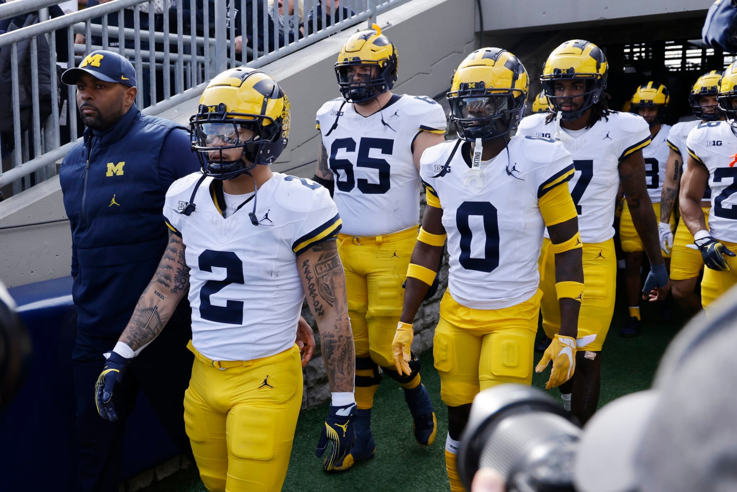 UNIVERSITY PARK, PA - NOVEMBER 11: Michigan Wolverines running backs coach Mike Hart walks to the field with his team prior to filling in for suspended head coach Jim Harbaugh before a college football game against the Penn State Nittany Lions on November 11, 2023 at Beaver Stadium in University Park, Pennsylvania. (Photo by Joe Robbins/Icon Sportswire via Getty Images)