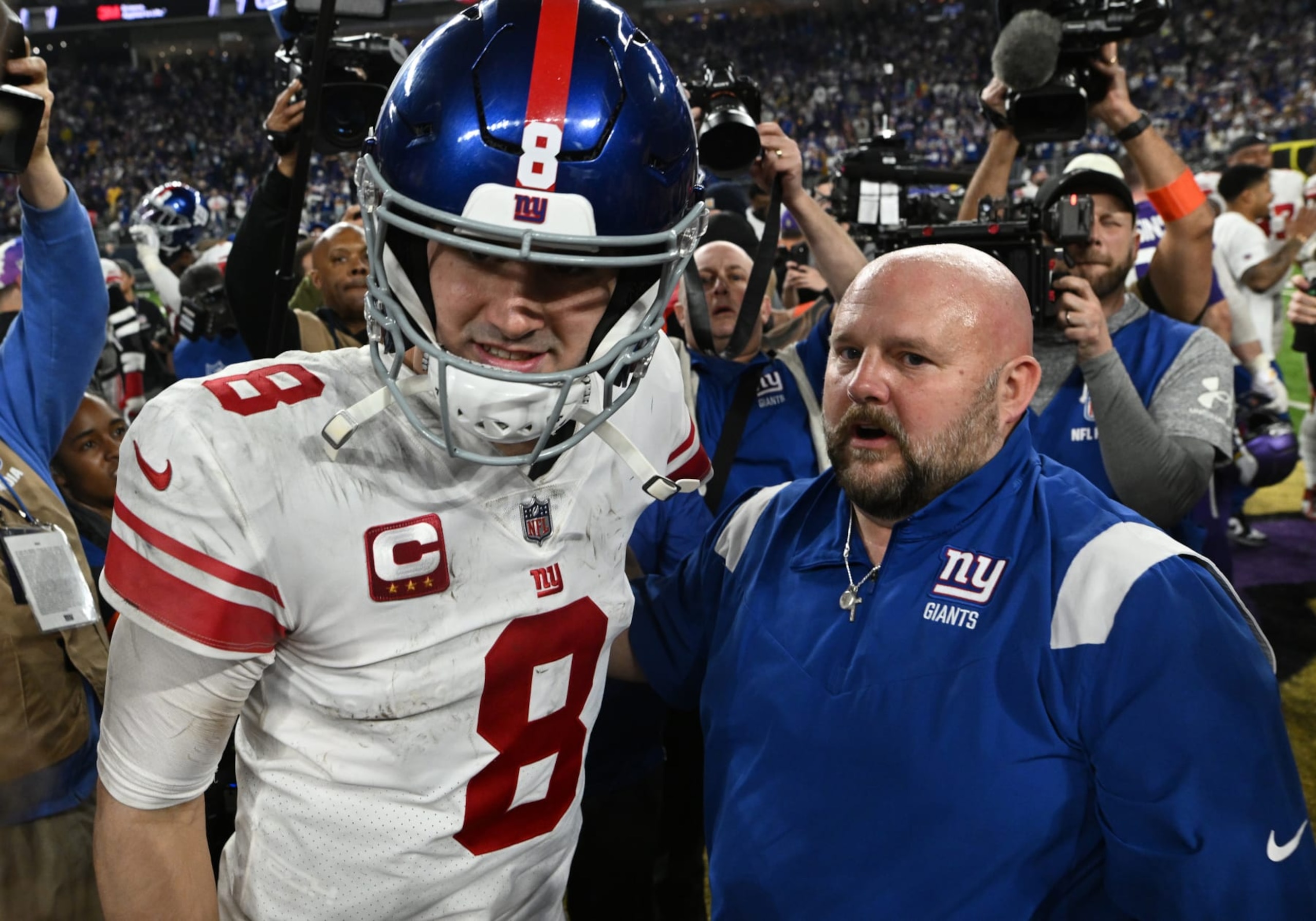 MINNEAPOLIS, MINNESOTA - JANUARY 15: Daniel Jones #8 and head coach Brian Daboll of the New York Giants are seen after defeating the Minnesota Vikings in the NFC Wild Card playoff game at U.S. Bank Stadium on January 15, 2023 in Minneapolis, Minnesota. (Photo by Stephen Maturen/Getty Images) MINNEAPOLIS, MINNESOTA - JANUARY 15: Daniel Jones #8 and head coach Brian Daboll of the New York Giants are seen after defeating the Minnesota Vikings in the NFC Wild Card playoff game at U.S. Bank Stadium on January 15, 2023 in Minneapolis, Minnesota. (Photo by Stephen Maturen/Getty Images)