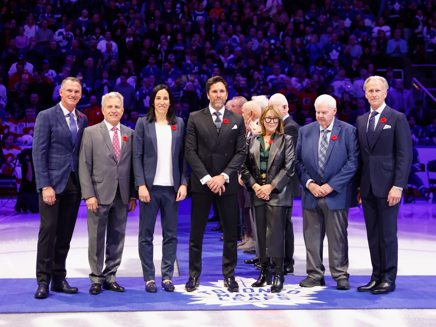 TORONTO, CANADA - NOVEMBER 10: Hockey Hall of Fame inductees (L-R) Pierre Turgeon, Mike Vernon, Caroline Ouellette, Henrik Lundqvist, Coco Lacroix (for Pierre Lacroix), Ken Hitchcock and Tom Barrasso  are honored prior to the game between the Toronto Maple Leafs and the Calgary Flames at Scotiabank Arena on November 10, 2023 in Toronto, Ontario, Canada. (Photo by Bruce Bennett/Getty Images)