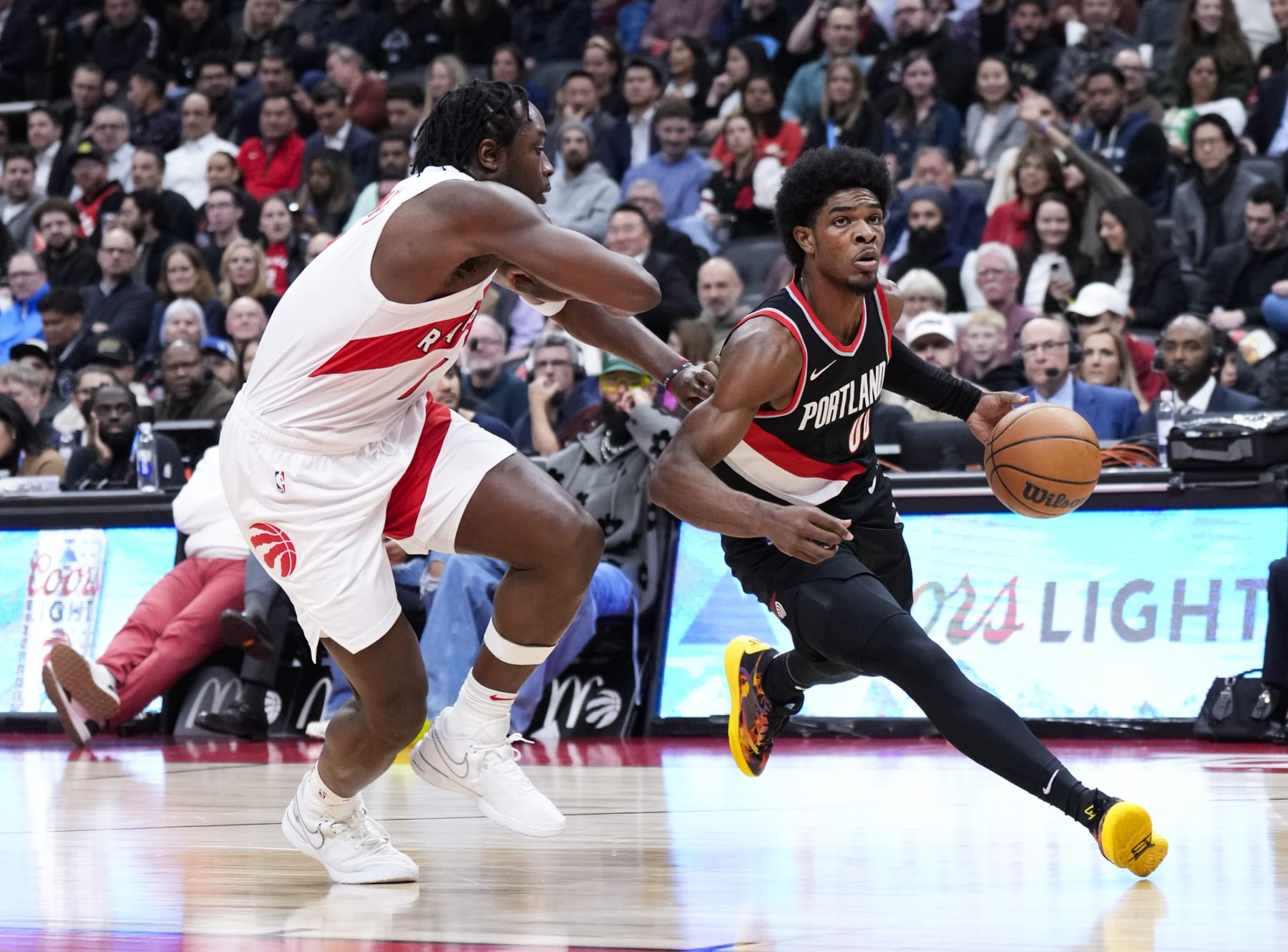 TORONTO, ON - OCTOBER 30: Scoot Henderson #00 of the Portland Trail Blazers drives against O.G. Anunoby #3 of the Toronto Raptors during the first half of their basketball game at the Scotiabank Arena on October 30, 2023 in Toronto, Ontario, Canada. NOTE TO USER: User expressly acknowledges and agrees that, by downloading and/or using this Photograph, user is consenting to the terms and conditions of the Getty Images License Agreement. (Photo by Mark Blinch/Getty Images)