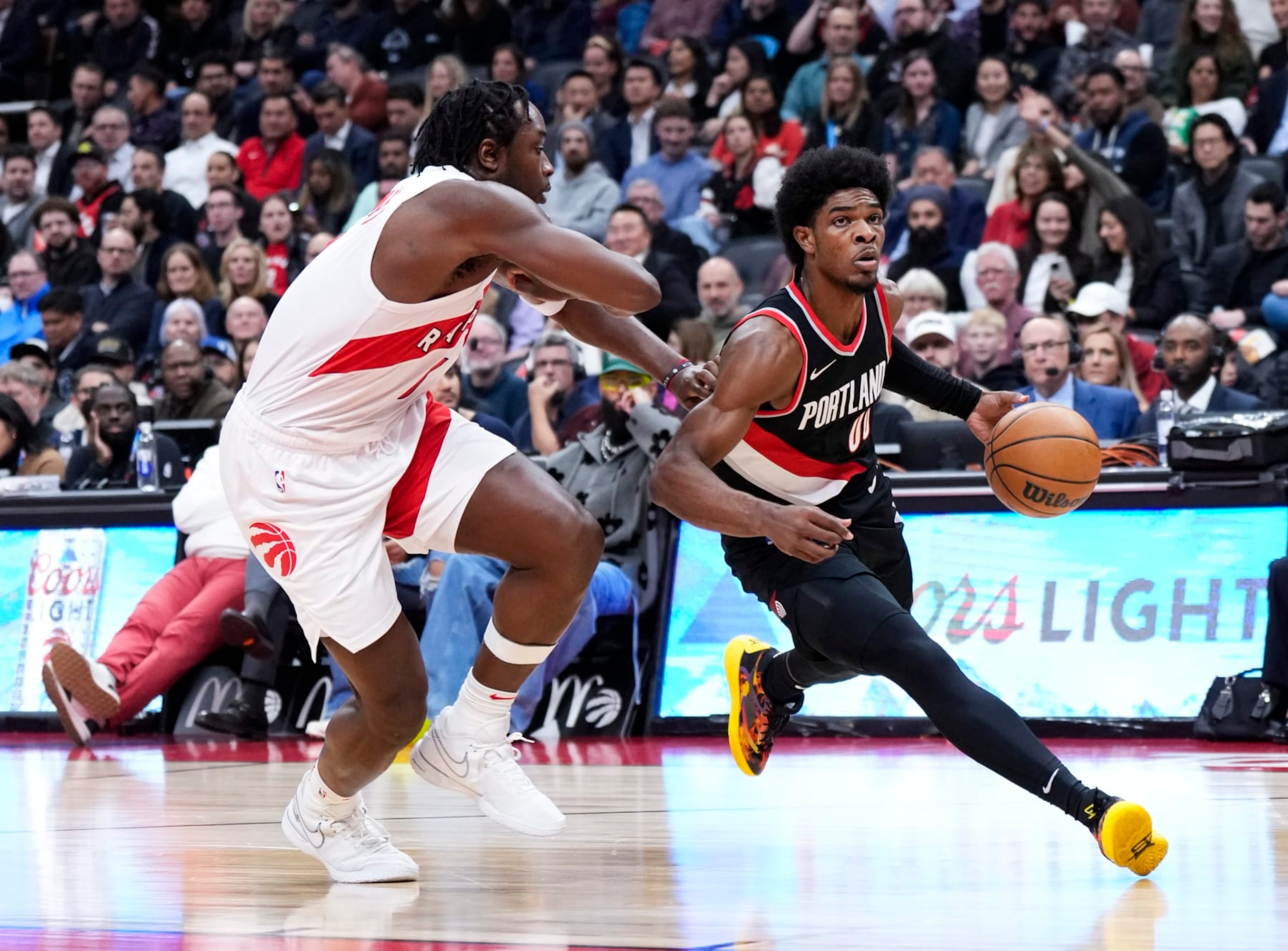 TORONTO, ON - OCTOBER 30: Scoot Henderson #00 of the Portland Trail Blazers drives against O.G. Anunoby #3 of the Toronto Raptors during the first half of their basketball game at the Scotiabank Arena on October 30, 2023 in Toronto, Ontario, Canada. NOTE TO USER: User expressly acknowledges and agrees that, by downloading and/or using this Photograph, user is consenting to the terms and conditions of the Getty Images License Agreement. (Photo by Mark Blinch/Getty Images)