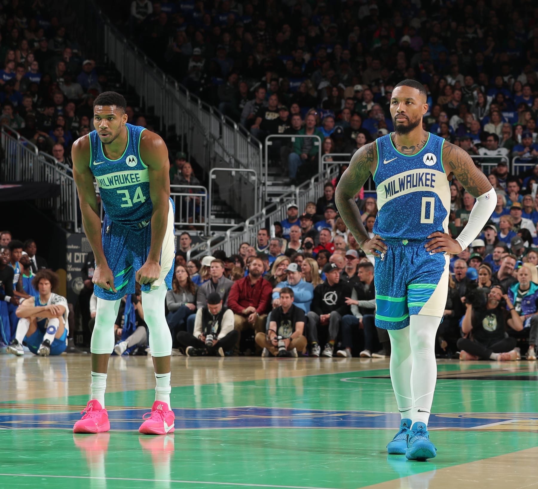 MILWAUKEE, WI - NOVEMBER 3: Damian Lillard #0 and Giannis Antetokounmpo #34 of the Milwaukee Bucks look on during the In Season Tournament against the New York Knicks on November 3, 2023 at the Fiserv Forum Center in Milwaukee, Wisconsin. NOTE TO USER: User expressly acknowledges and agrees that, by downloading and or using this Photograph, user is consenting to the terms and conditions of the Getty Images License Agreement. Mandatory Copyright Notice: Copyright 2023 NBAE (Photo by Gary Dineen/NBAE via Getty Images).