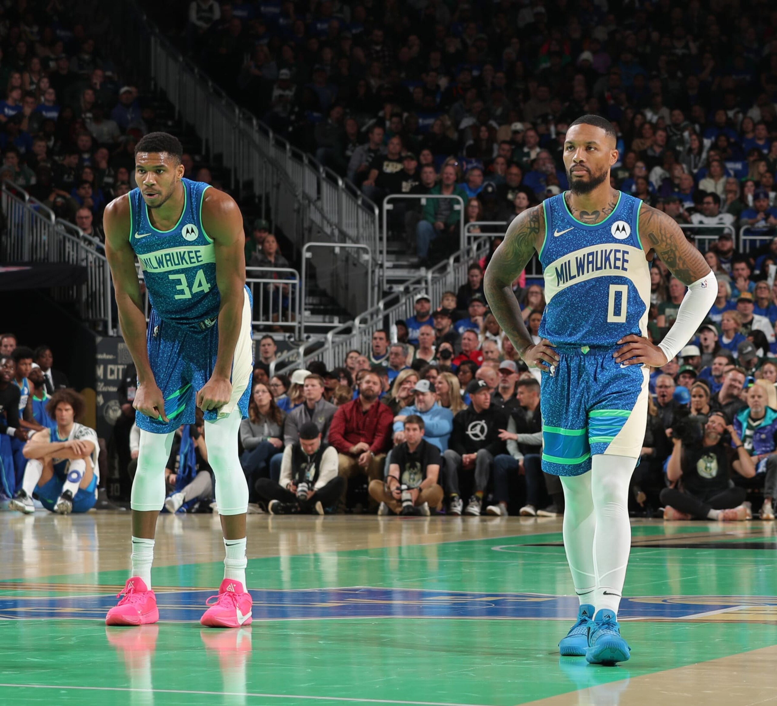 MILWAUKEE, WI - NOVEMBER 3: Damian Lillard #0 and Giannis Antetokounmpo #34 of the Milwaukee Bucks look on during the In Season Tournament against the New York Knicks on November 3, 2023 at the Fiserv Forum Center in Milwaukee, Wisconsin. NOTE TO USER: User expressly acknowledges and agrees that, by downloading and or using this Photograph, user is consenting to the terms and conditions of the Getty Images License Agreement. Mandatory Copyright Notice: Copyright 2023 NBAE (Photo by Gary Dineen/NBAE via Getty Images).