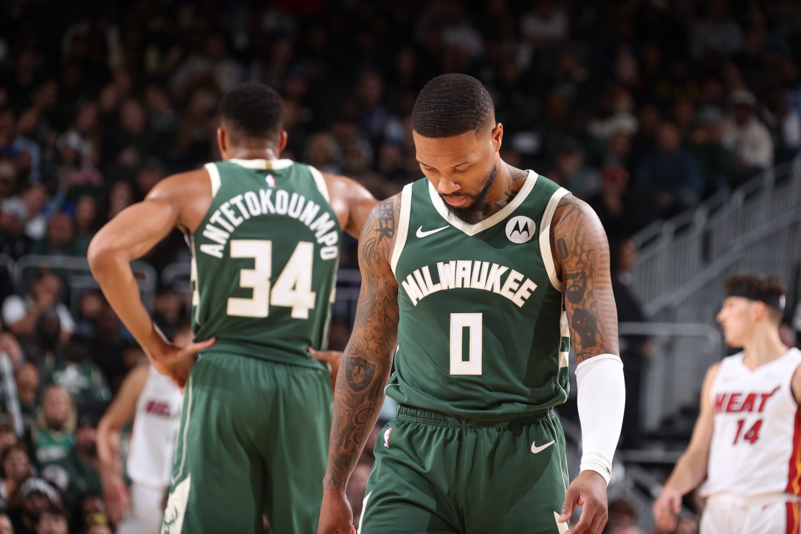 MILWAUKEE, WI - OCTOBER 30: Damian Lillard #0 of the Milwaukee Bucks looks on during the game against the Miami Heat on October 30, 2023 at the Fiserv Forum Center in Milwaukee, Wisconsin. NOTE TO USER: User expressly acknowledges and agrees that, by downloading and or using this Photograph, user is consenting to the terms and conditions of the Getty Images License Agreement. Mandatory Copyright Notice: Copyright 2023 NBAE (Photo by Nathaniel S. Butler/NBAE via Getty Images).