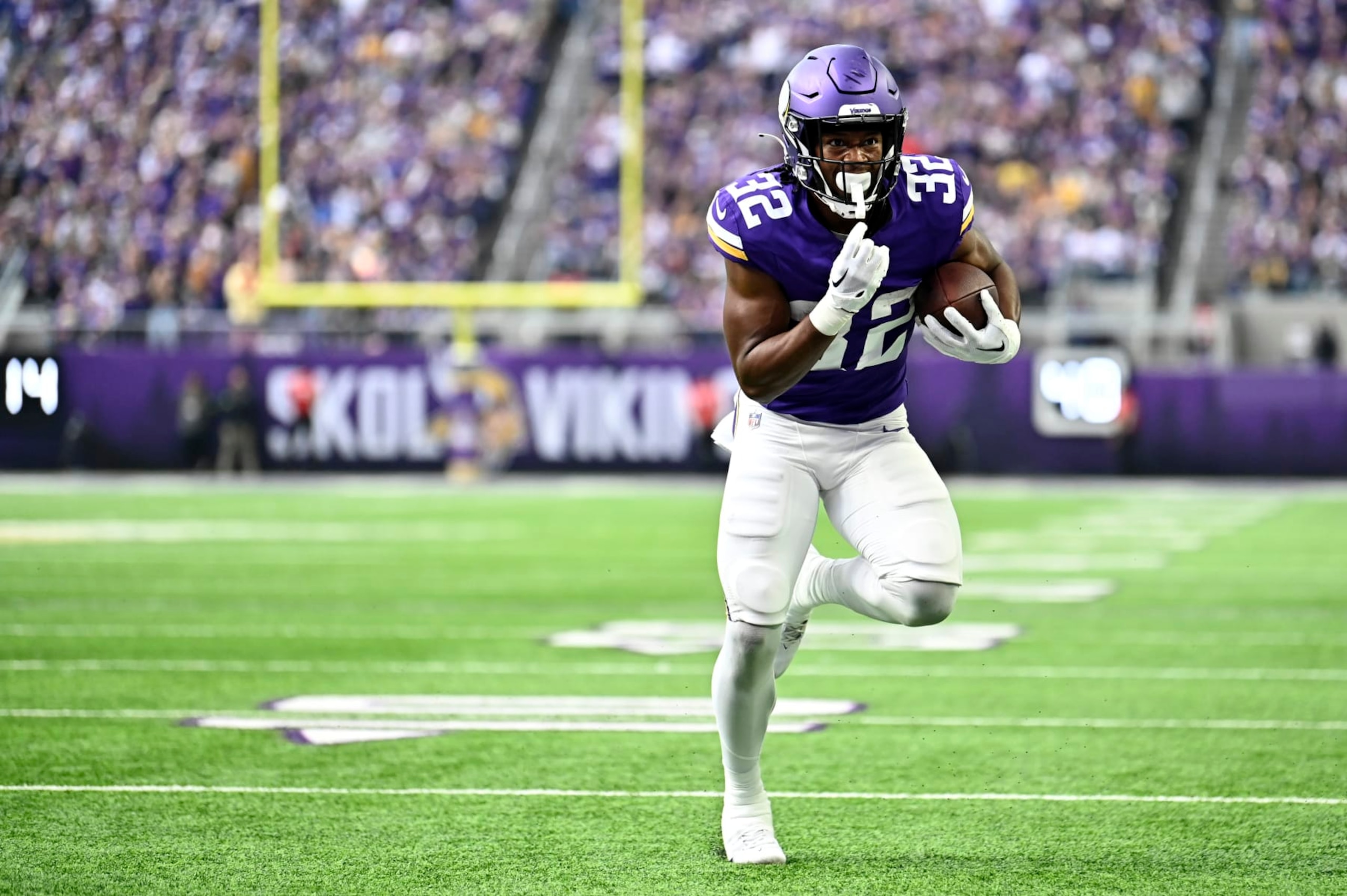 MINNEAPOLIS, MINNESOTA - NOVEMBER 12: Ty Chandler #32 of the Minnesota Vikings scores a touchdown against the New Orleans Saints during the second quarter at U.S. Bank Stadium on November 12, 2023 in Minneapolis, Minnesota. (Photo by Stephen Maturen/Getty Images)