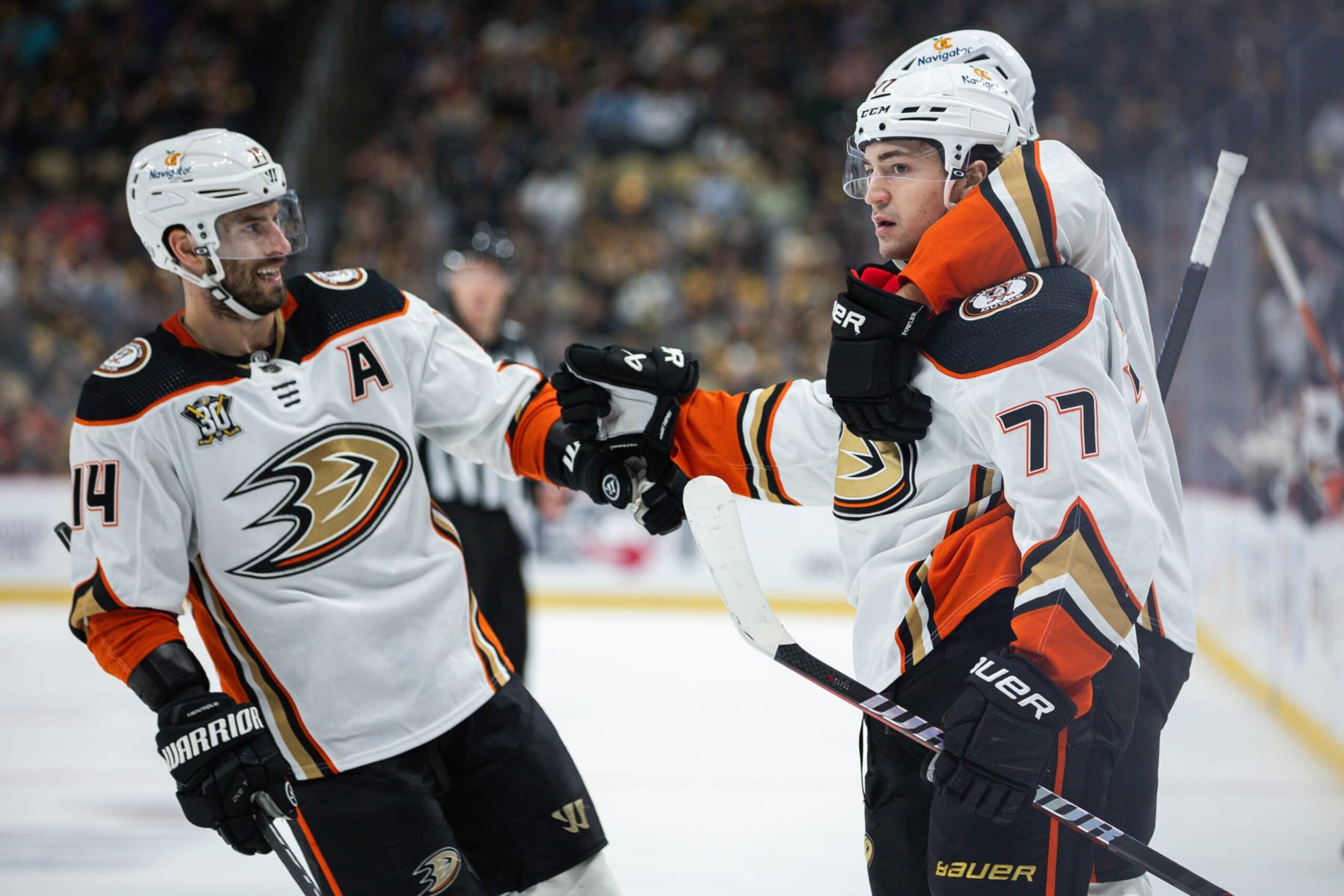 PITTSBURGH, PENNSYLVANIA - OCTOBER 30: Frank Vatrano #77 of the Anaheim Ducks celebrates with teammates after scoring a goal against the Pittsburgh Penguins during the second period at PPG PAINTS Arena on October 30, 2023 in Pittsburgh, Pennsylvania. (Photo by Harrison Barden/Getty Images)