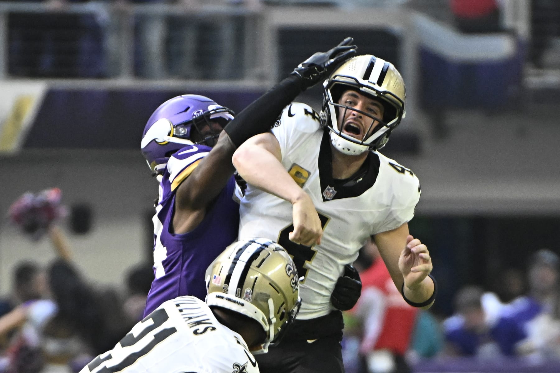 MINNEAPOLIS, MINNESOTA - NOVEMBER 12: Derek Carr #4 of the New Orleans Saints is hit by Josh Metellus #44 of the Minnesota Vikings during the first quarter at U.S. Bank Stadium on November 12, 2023 in Minneapolis, Minnesota. (Photo by Stephen Maturen/Getty Images)