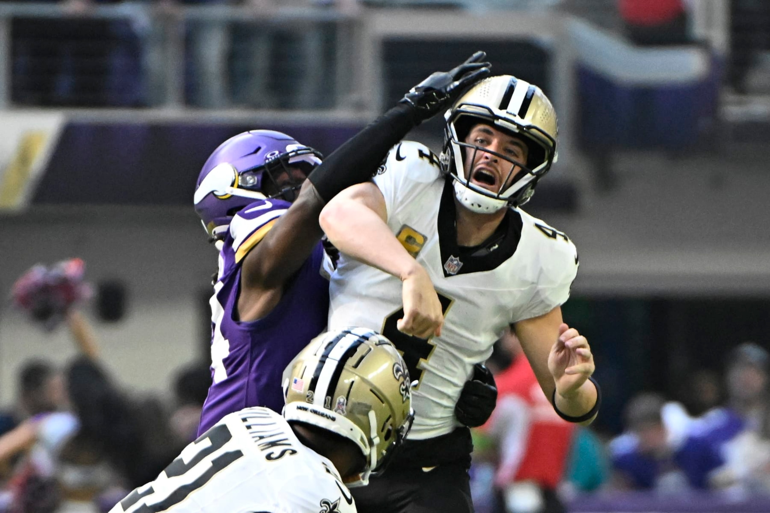MINNEAPOLIS, MINNESOTA - NOVEMBER 12: Derek Carr #4 of the New Orleans Saints is hit by Josh Metellus #44 of the Minnesota Vikings during the first quarter at U.S. Bank Stadium on November 12, 2023 in Minneapolis, Minnesota. (Photo by Stephen Maturen/Getty Images)