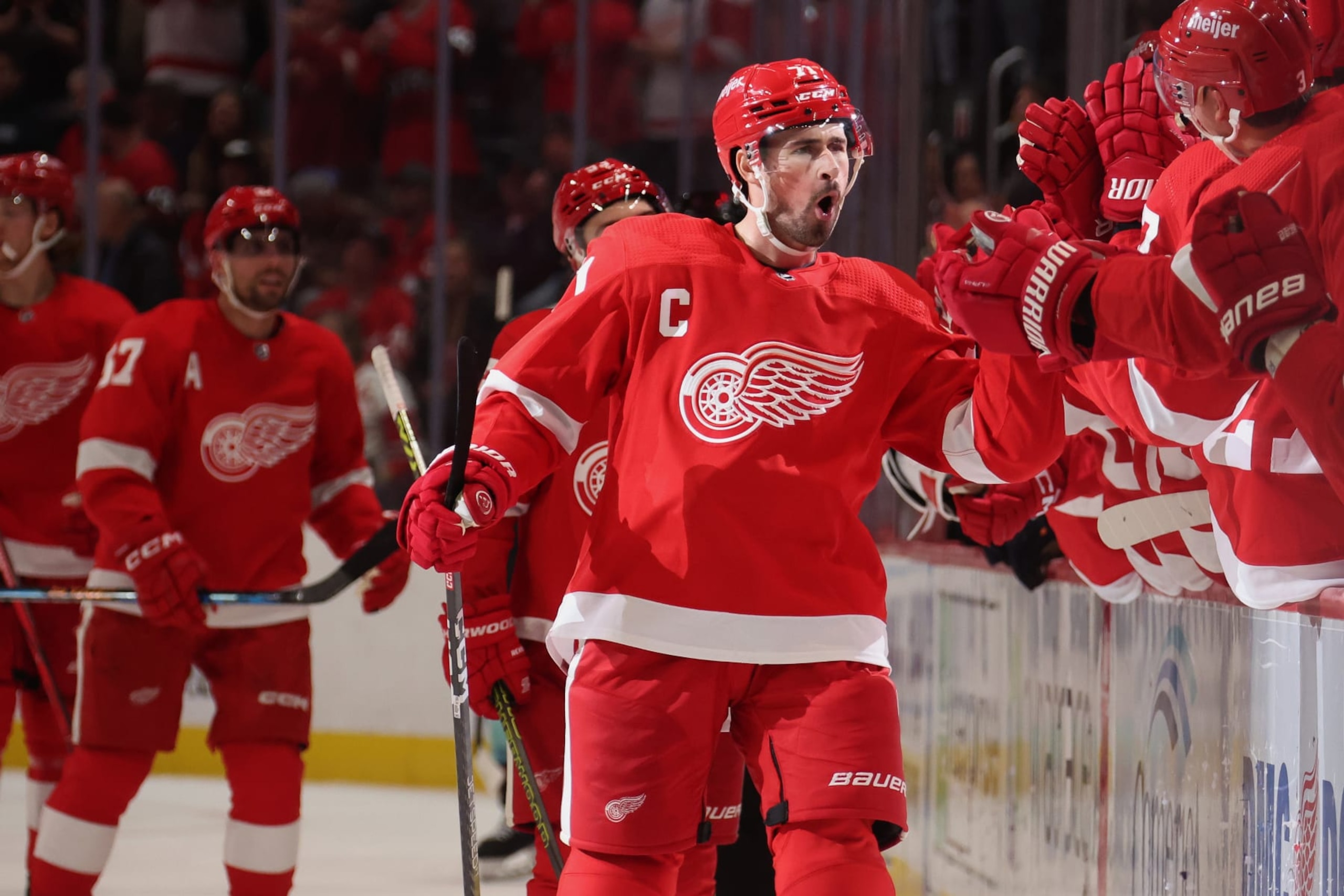 DETROIT, MICHIGAN - OCTOBER 24: Dylan Larkin #71 of the Detroit Red Wings celebrates his third period goal with teammates while playing the Seattle Kraken at Little Caesars Arena on October 24, 2023 in Detroit, Michigan. (Photo by Gregory Shamus/Getty Images)
