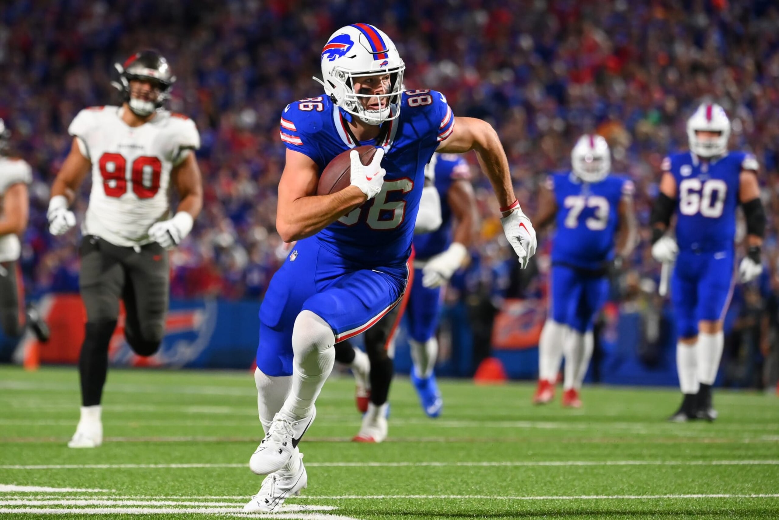 ORCHARD PARK, NEW YORK - OCTOBER 26: Dalton Kincaid #86 of the Buffalo Bills runs with the ball after a catch against the Tampa Bay Buccaneers during the first half at Highmark Stadium on October 26, 2023 in Orchard Park, New York. (Photo by Rich Barnes/Getty Images)