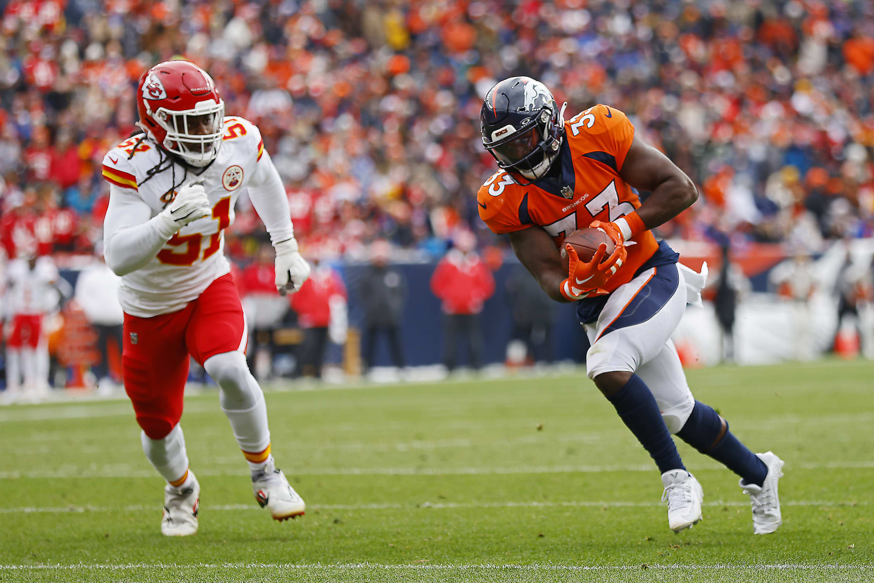 DENVER, COLORADO - OCTOBER 29: Javonte Williams #33 of the Denver Broncos catches a pass to run for a first quarter touchdown during a game against the Kansas City Chiefs at Empower Field At Mile High on October 29, 2023 in Denver, Colorado. (Photo by Justin Edmonds/Getty Images)