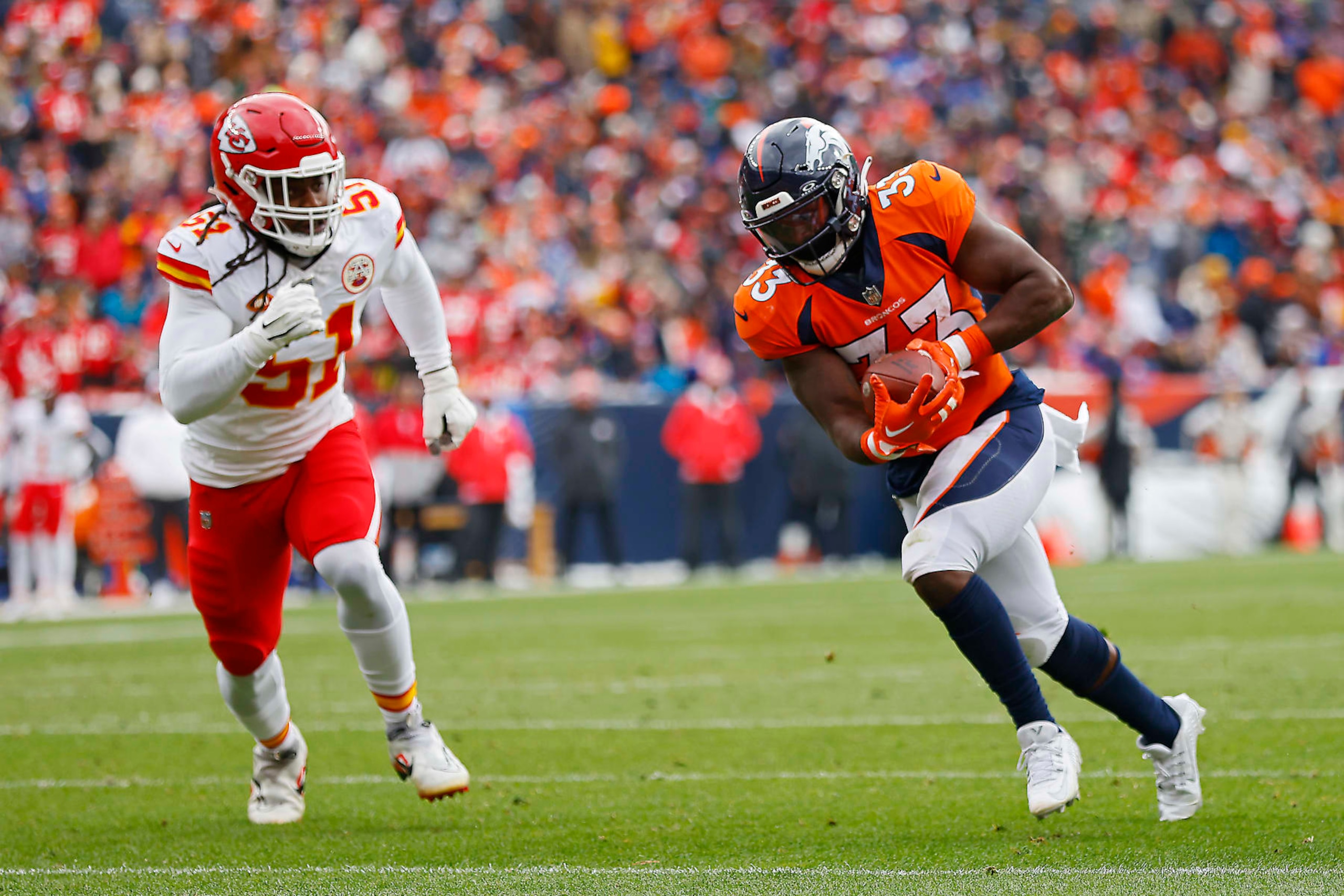 DENVER, COLORADO - OCTOBER 29: Javonte Williams #33 of the Denver Broncos catches a pass to run for a first quarter touchdown during a game against the Kansas City Chiefs at Empower Field At Mile High on October 29, 2023 in Denver, Colorado. (Photo by Justin Edmonds/Getty Images)