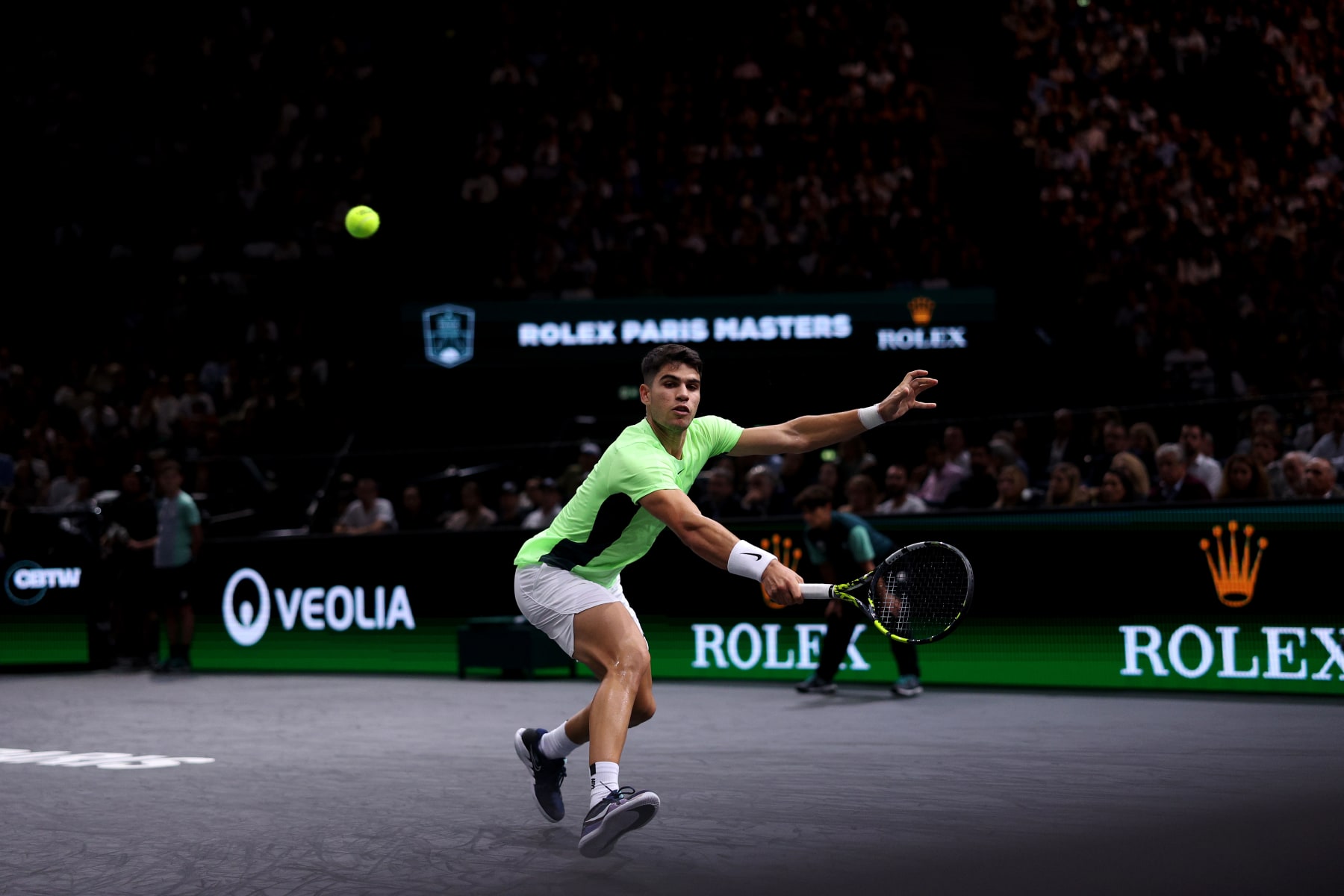 PARIS, FRANCE - OCTOBER 31: Carlos Alcaraz of Spain returns a backhand in his match against Roman Safiullin of Russia during Day Two of the Rolex Paris Masters ATP Masters 1000 at Palais Omnisports de Bercy on October 31, 2023 in Paris, France. (Photo by Dean Mouhtaropoulos/Getty Images)