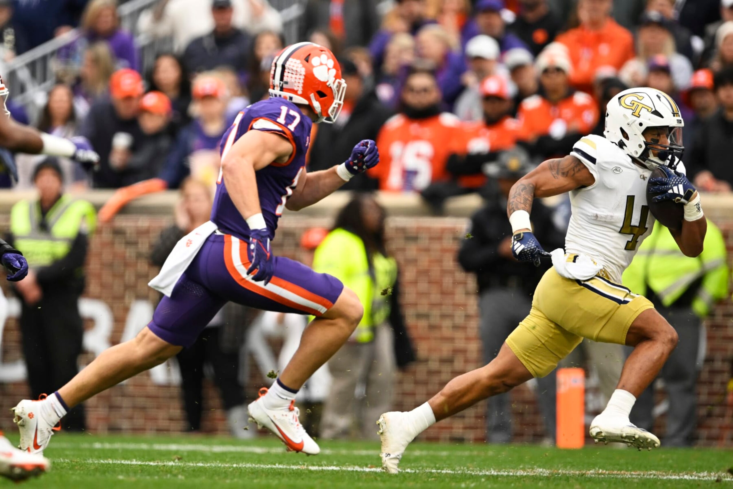 CLEMSON, SOUTH CAROLINA - NOVEMBER 11: Dontae Smith #4 of the Georgia Tech Yellow Jackets runs for yardage against Wade Woodaz #17 of the Clemson Tigers in the first quarter at Memorial Stadium on November 11, 2023 in Clemson, South Carolina. (Photo by Eakin Howard/Getty Images)