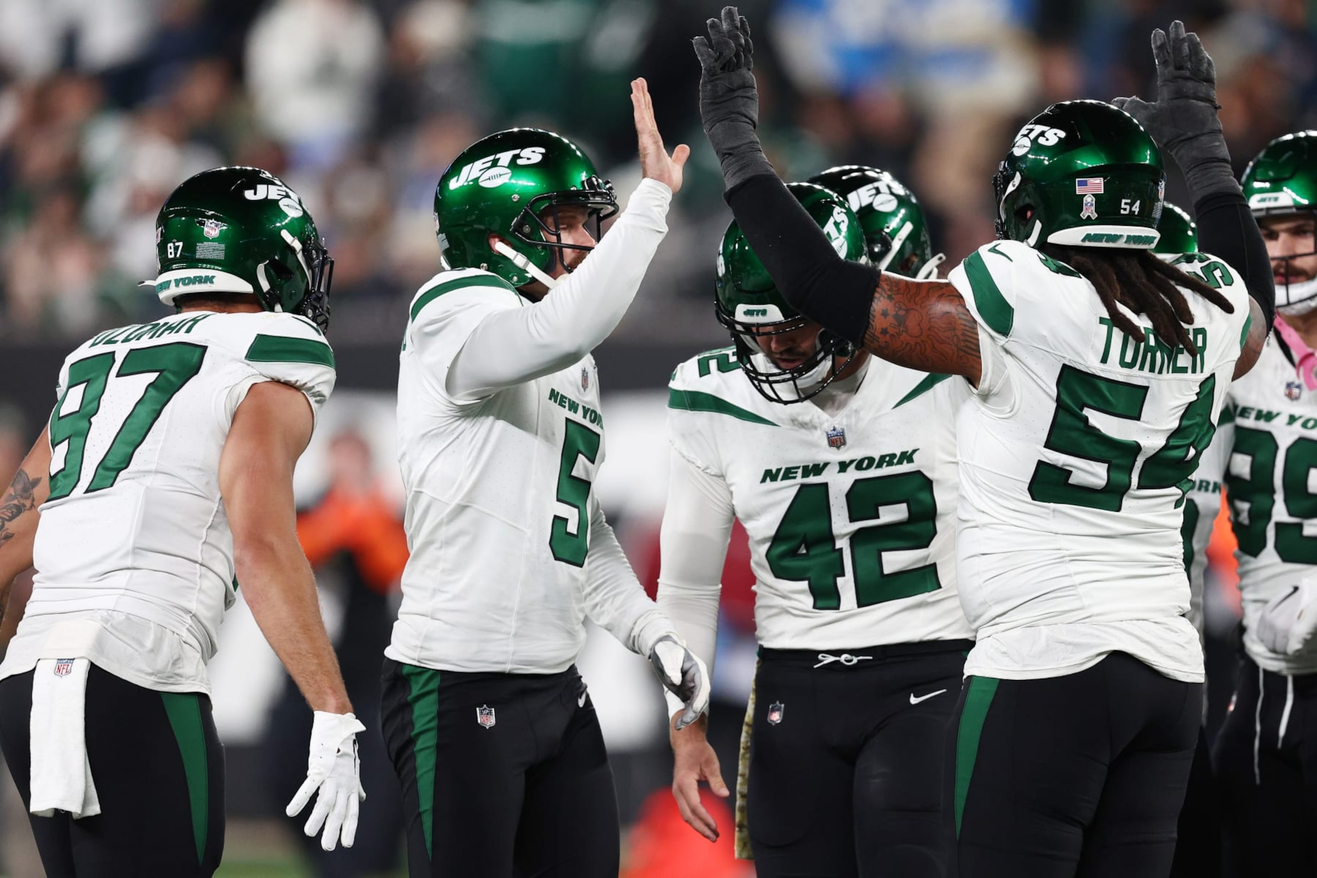 EAST RUTHERFORD, NEW JERSEY - NOVEMBER 06: Greg Zuerlein #9 of the New York Jets celebrates with teammates after kicking a 47-yard field goal during the second quarter against the Los Angeles Chargers at MetLife Stadium on November 06, 2023 in East Rutherford, New Jersey. (Photo by Elsa/Getty Images)