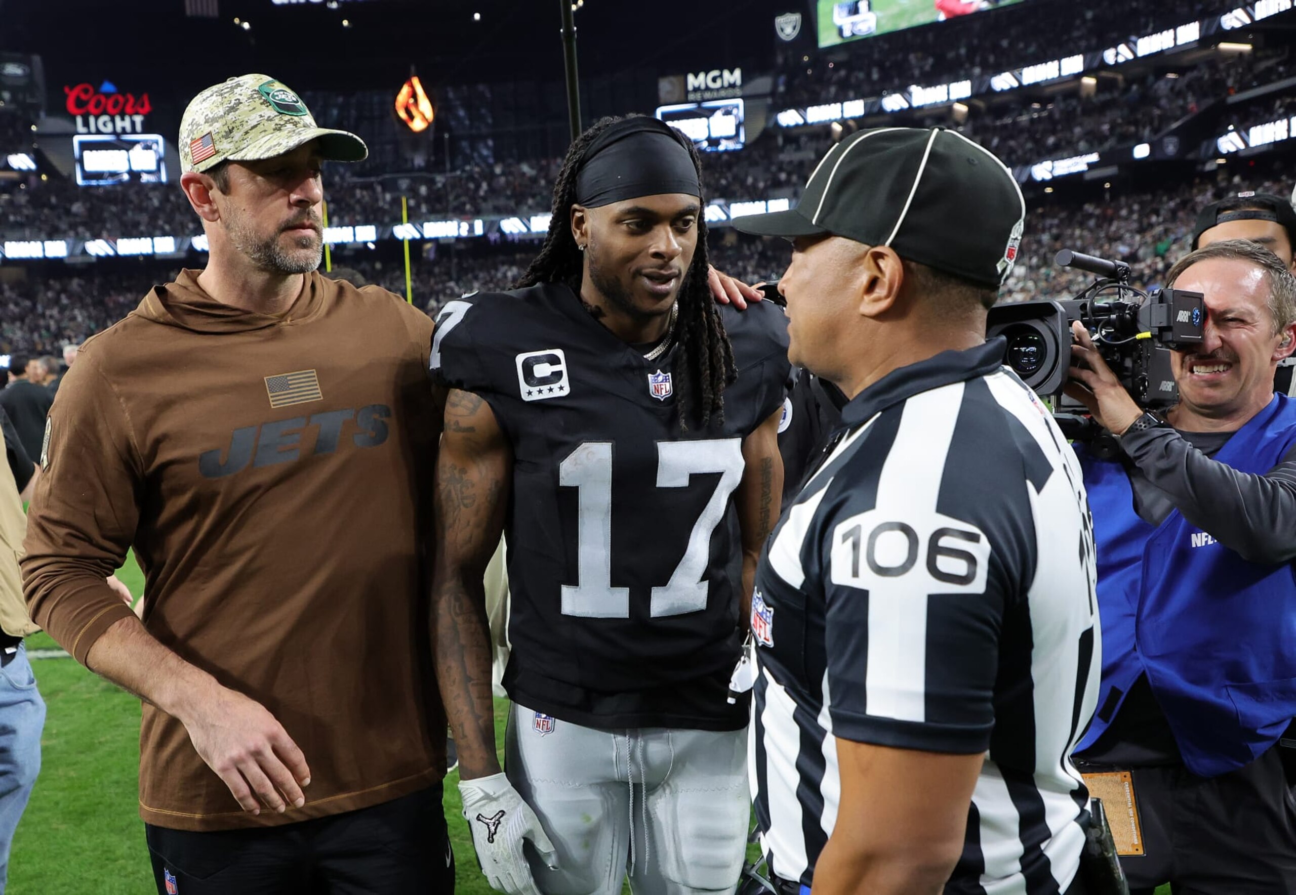 LAS VEGAS, NEVADA - NOVEMBER 12:  Quarterback Aaron Rodgers #8 of the New York Jets talks with wide receiver Davante Adams #17 of the Las Vegas Raiders after the Raiders defeated the Jets to win the game at Allegiant Stadium on November 12, 2023 in Las Vegas, Nevada. (Photo by Ethan Miller/Getty Images)