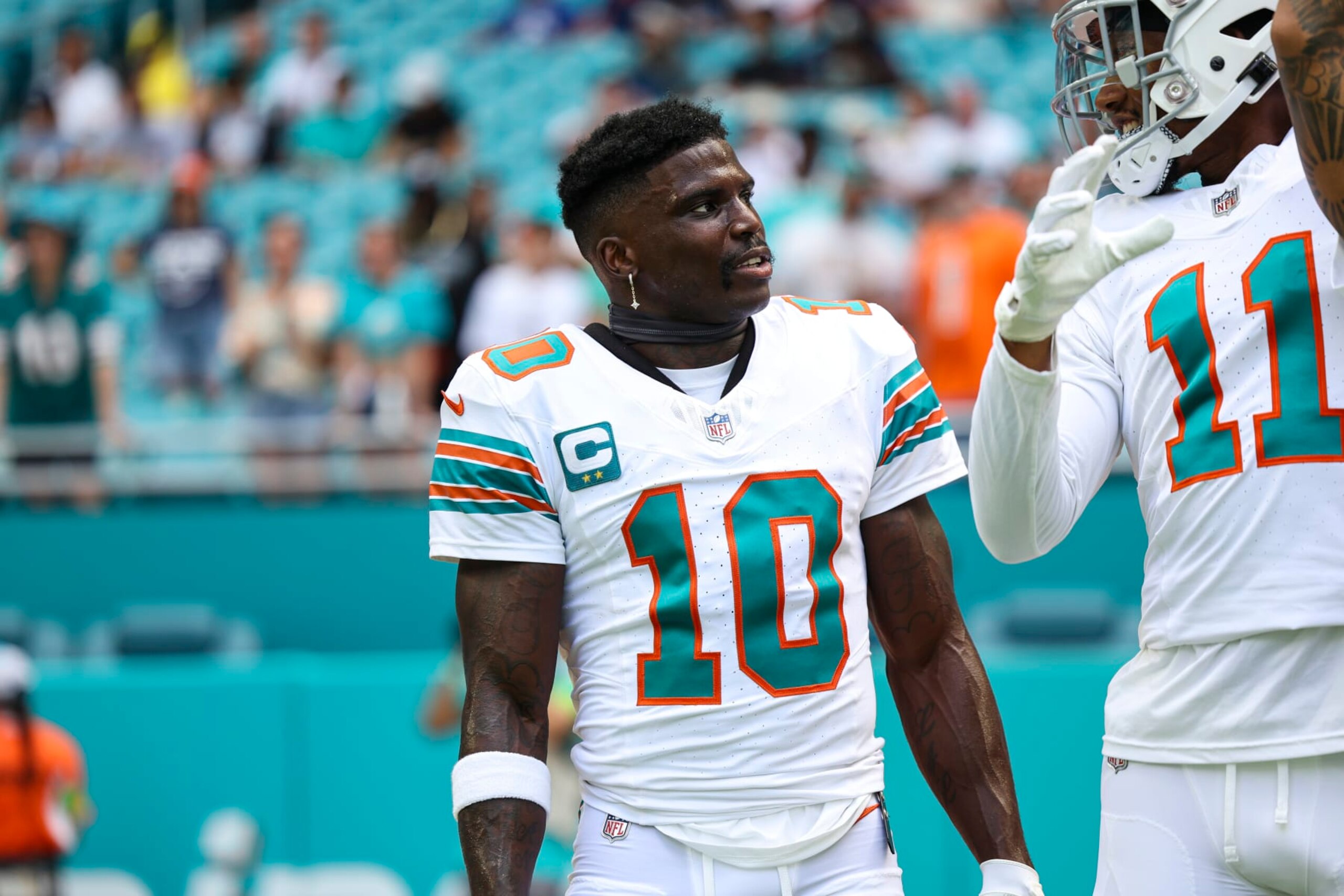 MIAMI GARDENS, FL - OCTOBER 29: Tyreek Hill #10 of the Miami Dolphins warms up prior to an NFL football game against the New England Patriots at Hard Rock Stadium on October 29, 2023 in Miami Gardens, Florida. (Photo by Perry Knotts/Getty Images)