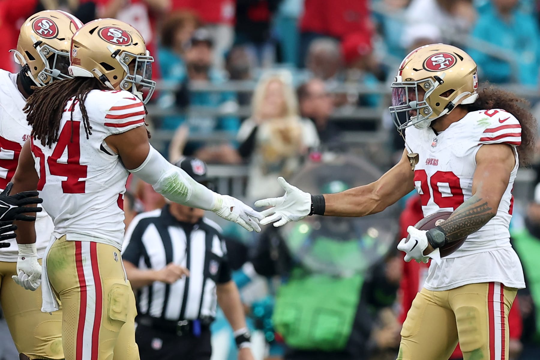 JACKSONVILLE, FLORIDA - NOVEMBER 12: Talanoa Hufanga #29 of the San Francisco 49ers celebrates with Fred Warner #54 of the San Francisco 49ers during the fourth quarter against the Jacksonville Jaguars at EverBank Stadium on November 12, 2023 in Jacksonville, Florida. (Photo by Mike Carlson/Getty Images)
