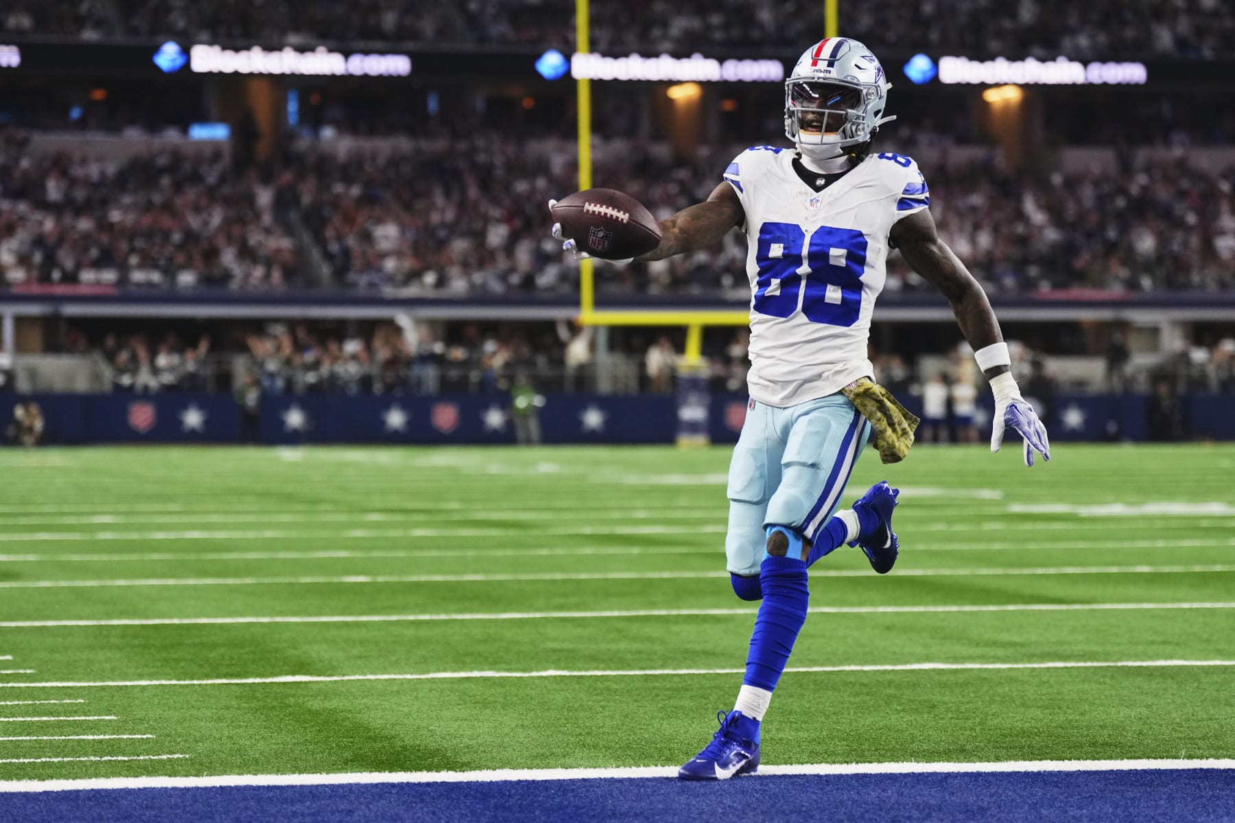 ARLINGTON, TX - NOVEMBER 12: CeeDee Lamb #88 of the Dallas Cowboys scores a touchdown against the New York Giants during the first half at AT&T Stadium on November 12, 2023 in Arlington, Texas. (Photo by Cooper Neill/Getty Images)