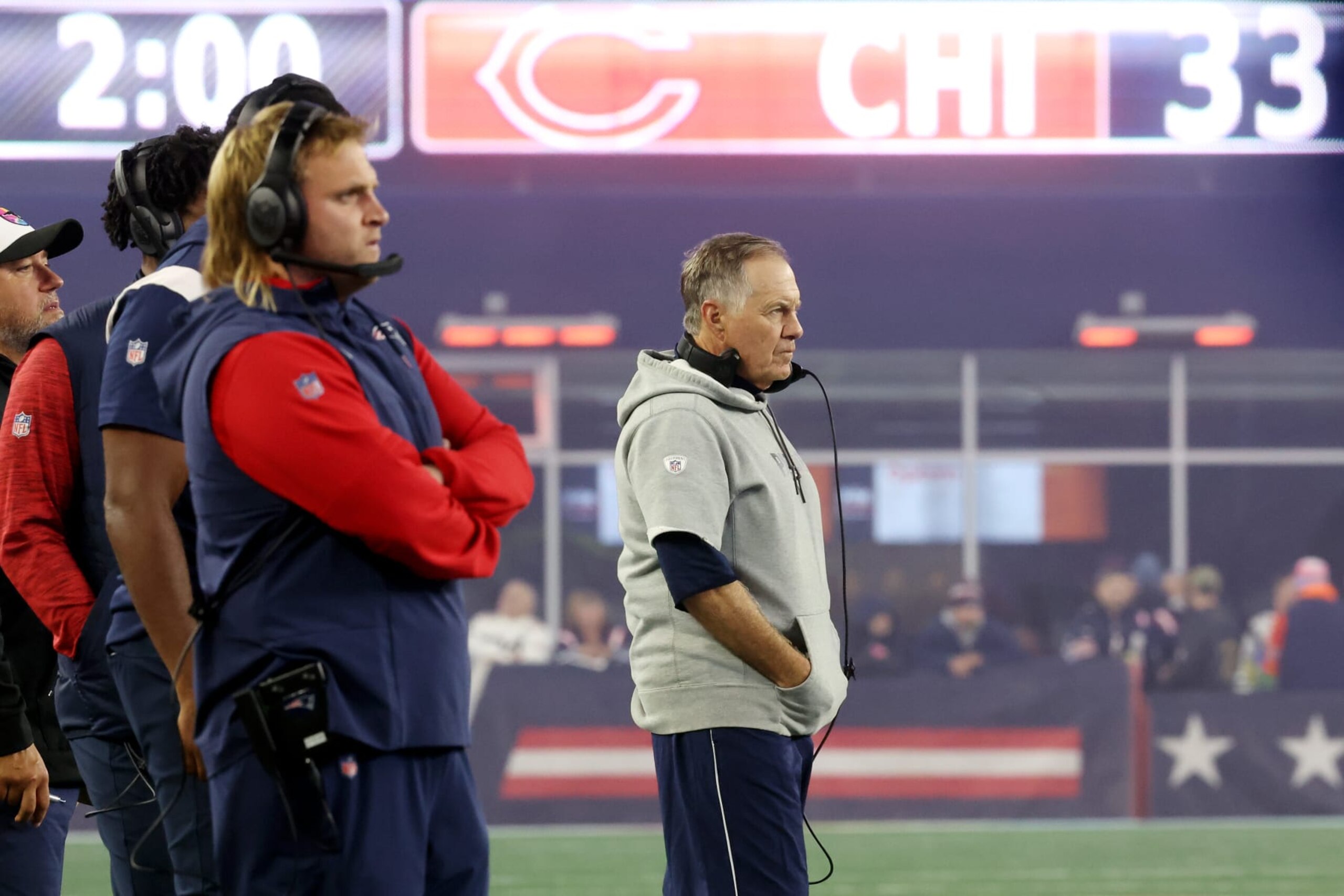 FOXBOROUGH, MASSACHUSETTS - OCTOBER 24: Outside linebackers coach Stephen Belichick and head coach Bill Belichick of the New England Patriots stand on the sideline during the fourth quarter against the Chicago Bears at Gillette Stadium on October 24, 2022 in Foxborough, Massachusetts. (Photo by Maddie Meyer/Getty Images)