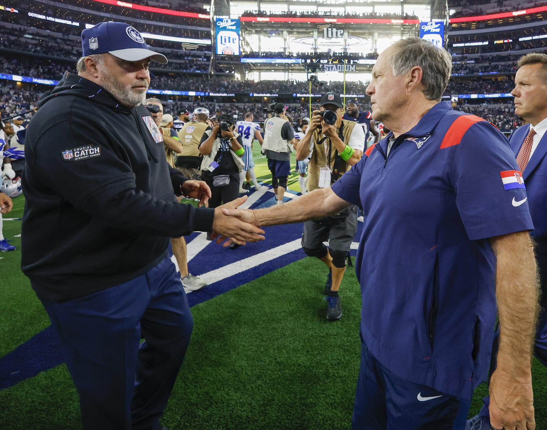 Arlington, TX - October 1: New England Patriots head coach Bill Belichick shakes hands with Dallas Cowboys head coach Mike McCarthy after the game. The Patriots lost to the Cowboys, 38-3. (Photo by Matthew J. Lee/The Boston Globe via Getty Images)