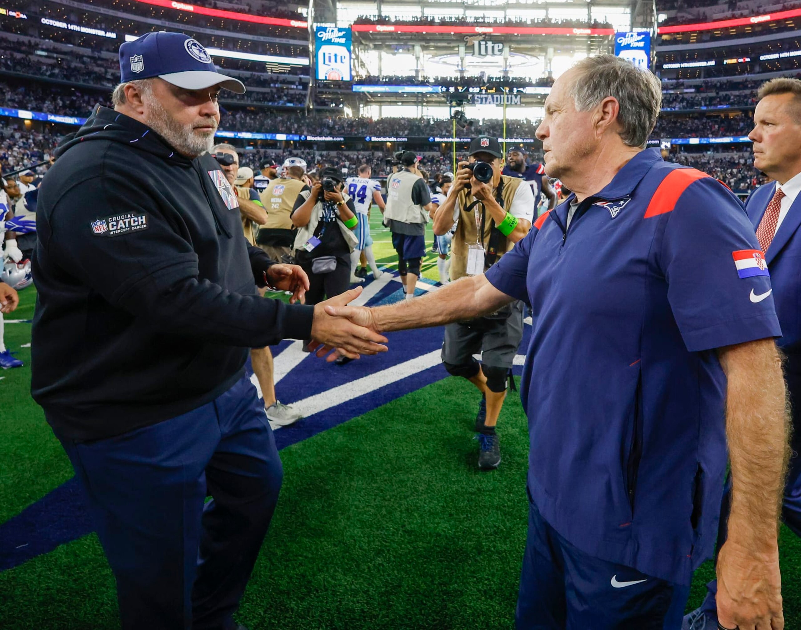 Arlington, TX - October 1: New England Patriots head coach Bill Belichick shakes hands with Dallas Cowboys head coach Mike McCarthy after the game. The Patriots lost to the Cowboys, 38-3. (Photo by Matthew J. Lee/The Boston Globe via Getty Images)