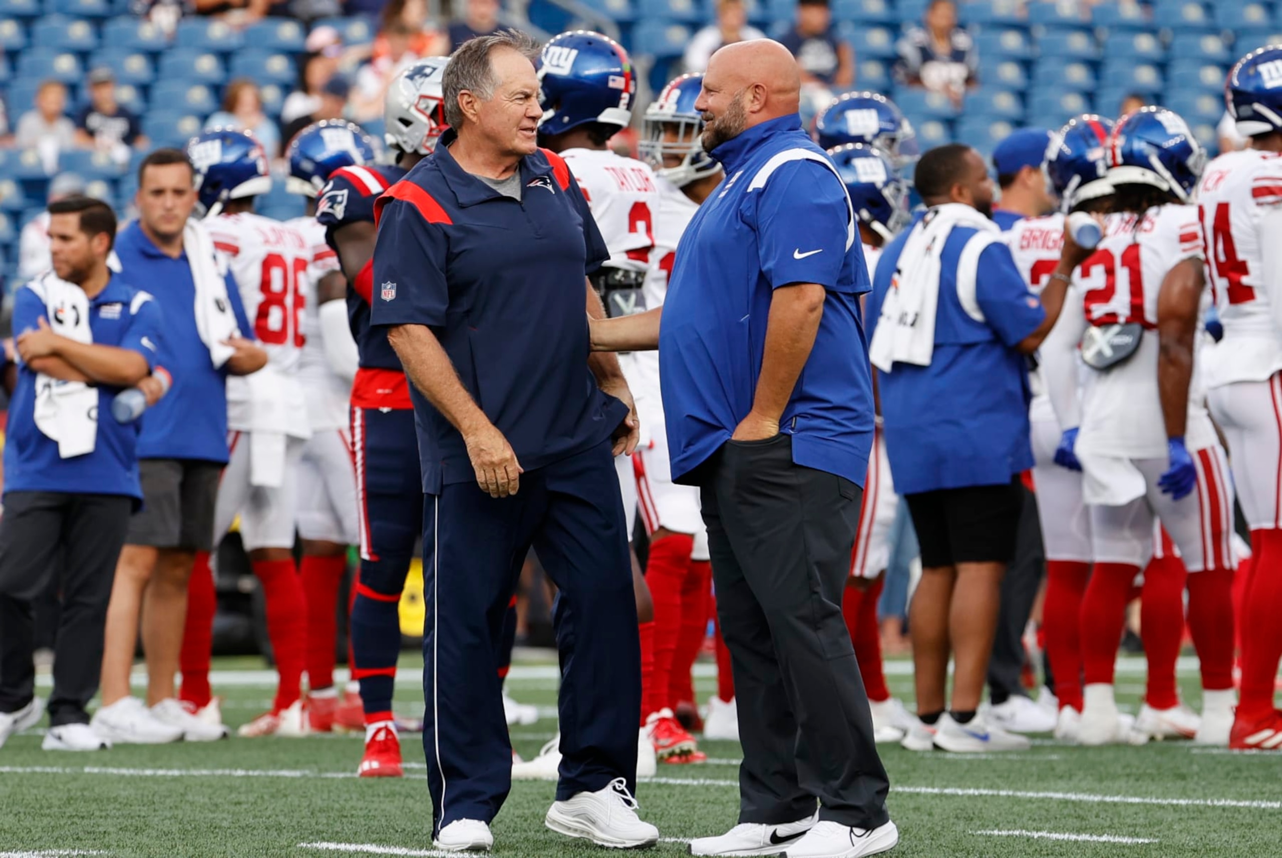FOXBOROUGH, MA - AUGUST 11: New England Patriots head coach Bill Belichick chats with New York Giants head coach Brian Daboll in warm up before an NFL preseason game between the New England Patriots and the New York Giants on August 11, 2022, at Gillette Stadium in Foxborough, Massachusetts. (Photo by Fred Kfoury III/Icon Sportswire via Getty Images)