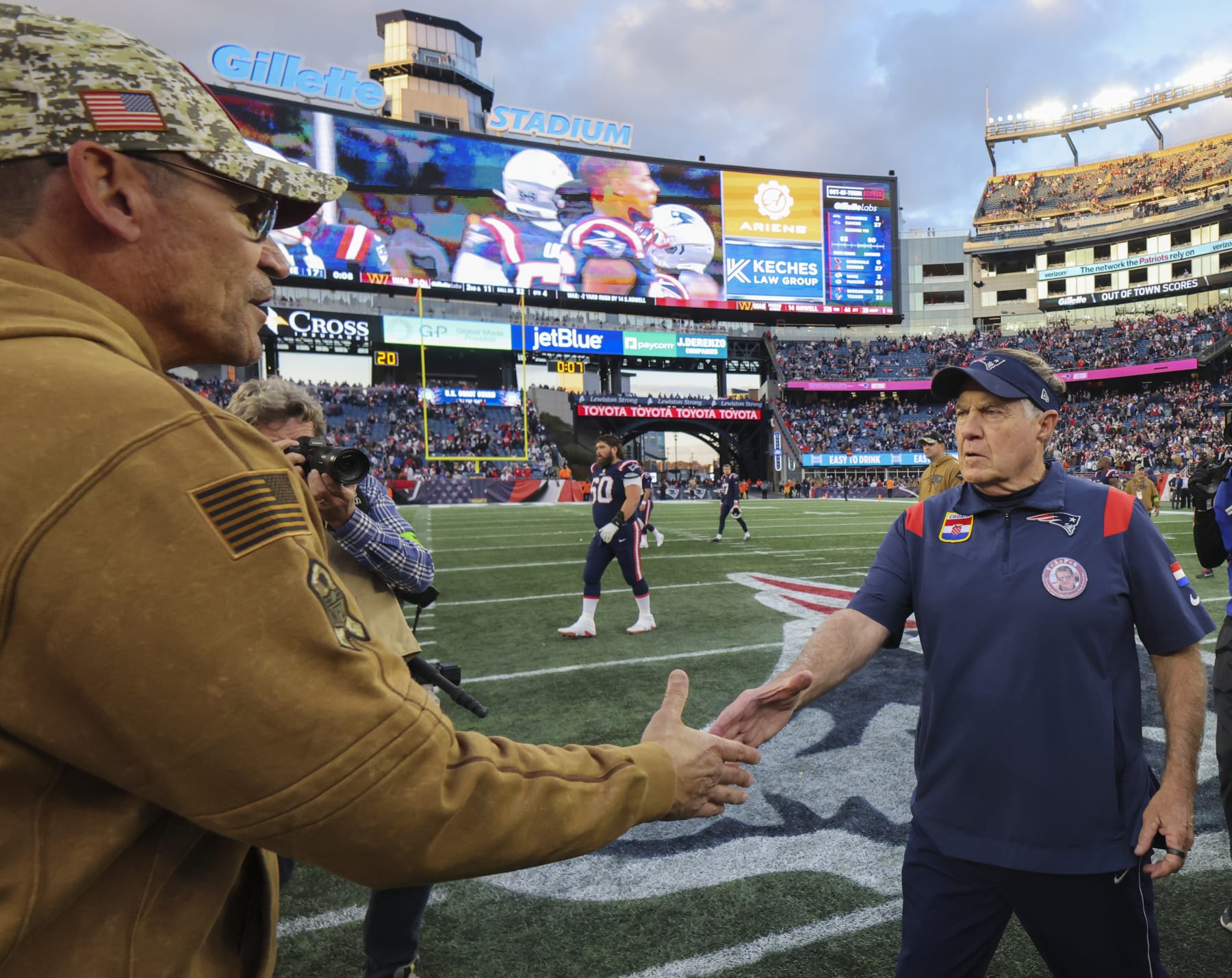 Foxborough, MA - November 5: New England Patriots head coach Bill Belichick shakes hands with Washington Commanders head coach Ron Rivera after the game. The Patriots lost to the Commanders, 20-17. (Photo by Matthew J. Lee/The Boston Globe via Getty Images)
