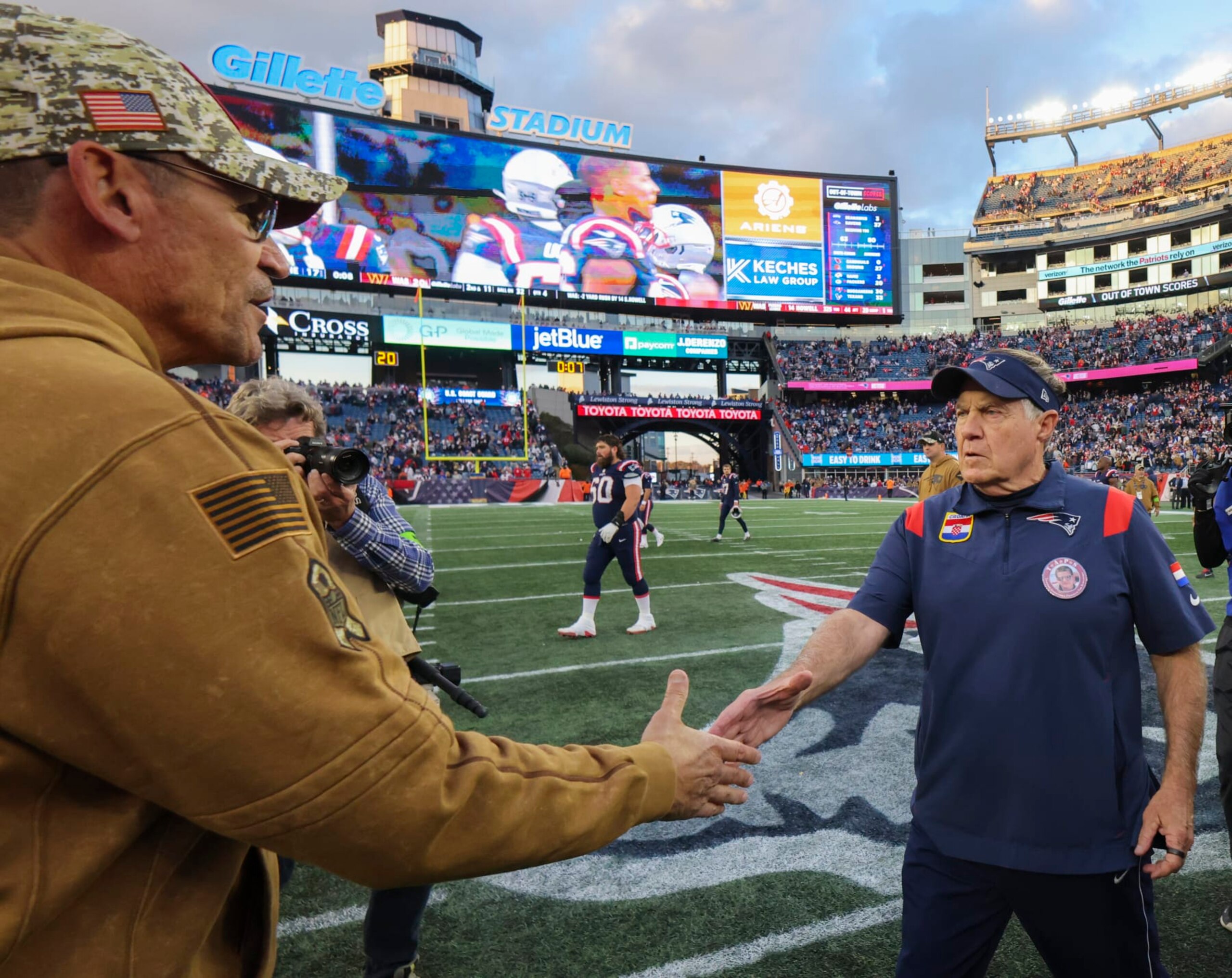 Foxborough, MA - November 5: New England Patriots head coach Bill Belichick shakes hands with Washington Commanders head coach Ron Rivera after the game. The Patriots lost to the Commanders, 20-17. (Photo by Matthew J. Lee/The Boston Globe via Getty Images)