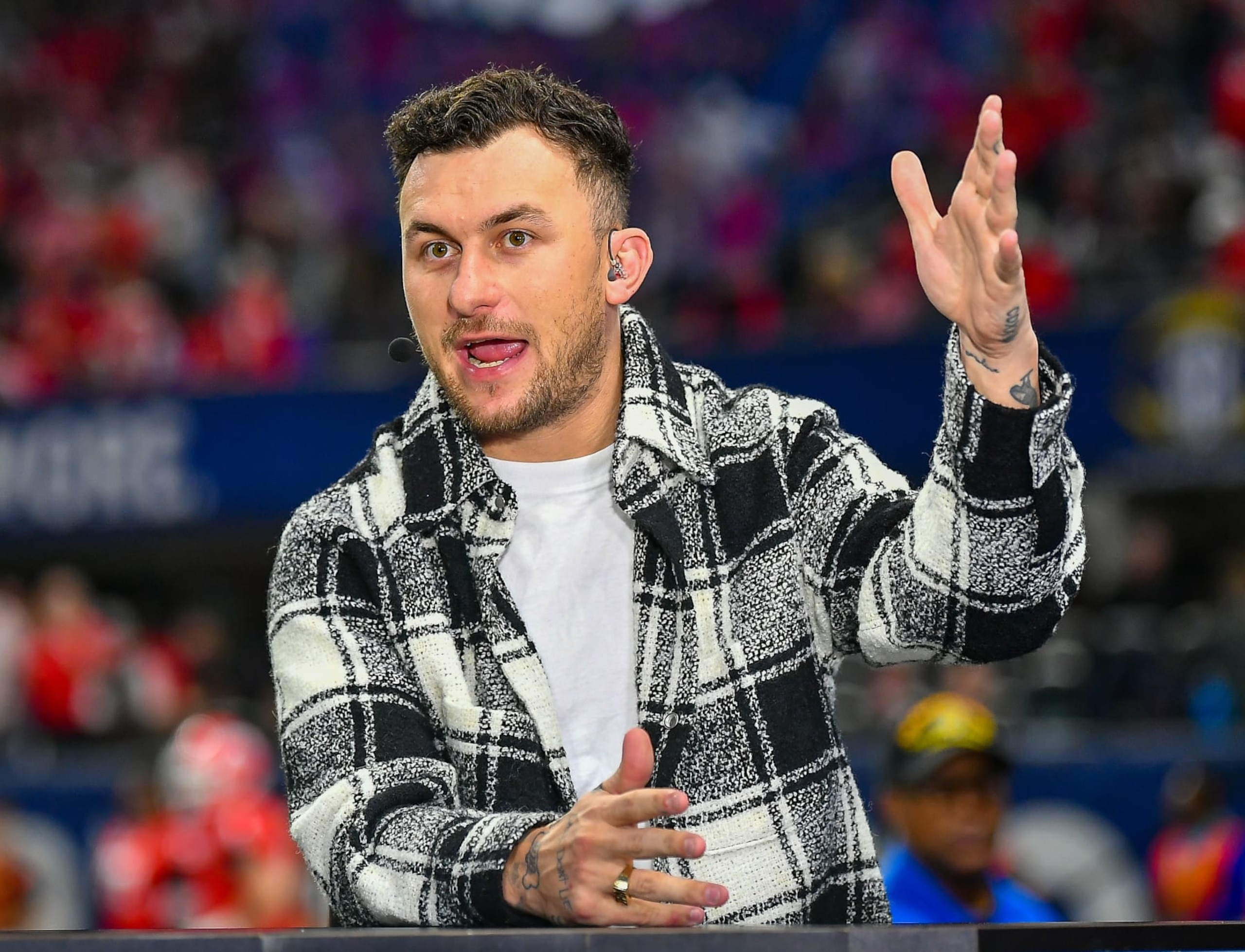 ATLANTA, GA - DECEMBER 03: Former Texas A&M quarterback Johnny Manziel is interviewed prior to the start of the SEC Championship football game between the LSU Tigers and the Georgia Bulldogs on December 3rd, 2022 at Mercedes-Benz Stadium in Atlanta, GA. (Photo by Rich von Biberstein/Icon Sportswire via Getty Images) ATLANTA, GA - DECEMBER 03: Former Texas A&M quarterback Johnny Manziel is interviewed prior to the start of the SEC Championship football game between the LSU Tigers and the Georgia Bulldogs on December 3rd, 2022 at Mercedes-Benz Stadium in Atlanta, GA. (Photo by Rich von Biberstein/Icon Sportswire via Getty Images)