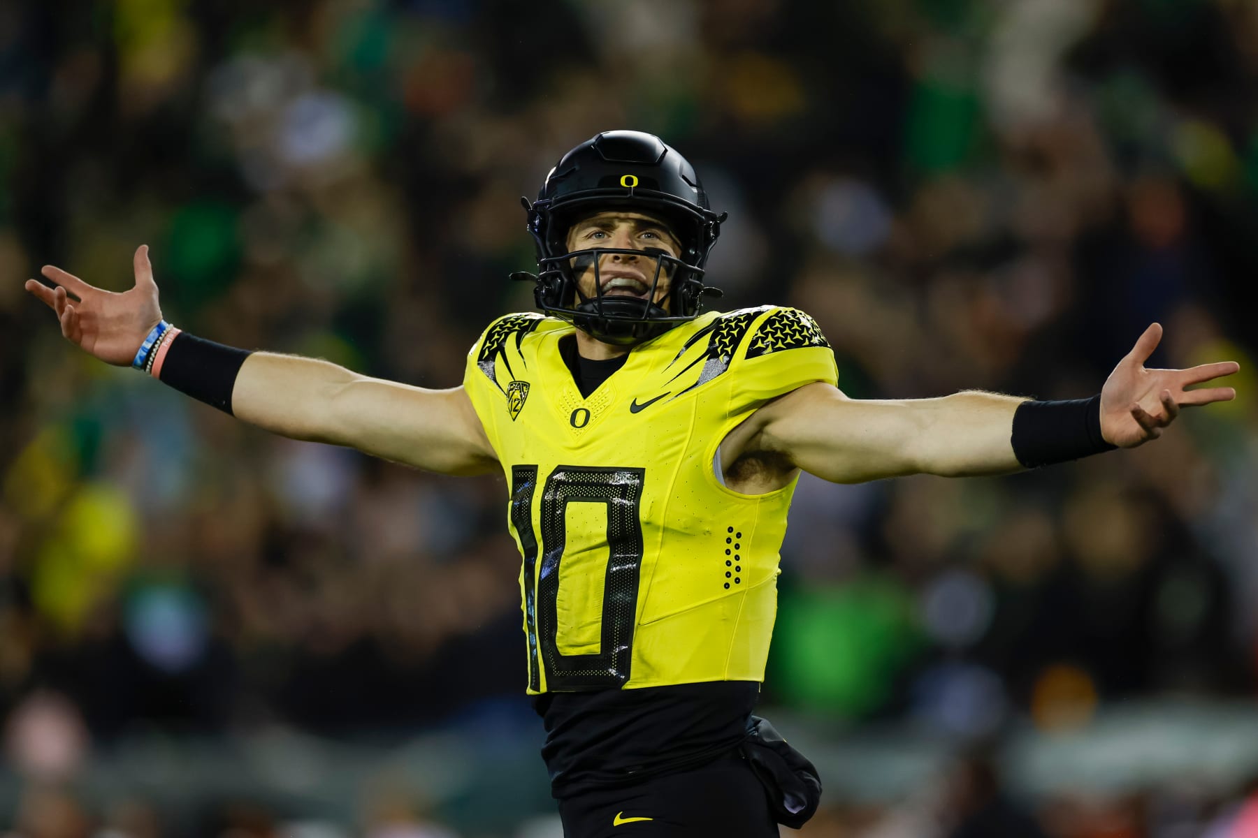 EUGENE, OREGON - NOVEMBER 11: Bo Nix #10 of the Oregon Ducks celebrates a touchdown pass in the first half during a game against the USC Trojans at Autzen Stadium on November 11, 2023 in Eugene, Oregon. (Photo by Brandon Sloter/Image Of Sport/Getty Images)