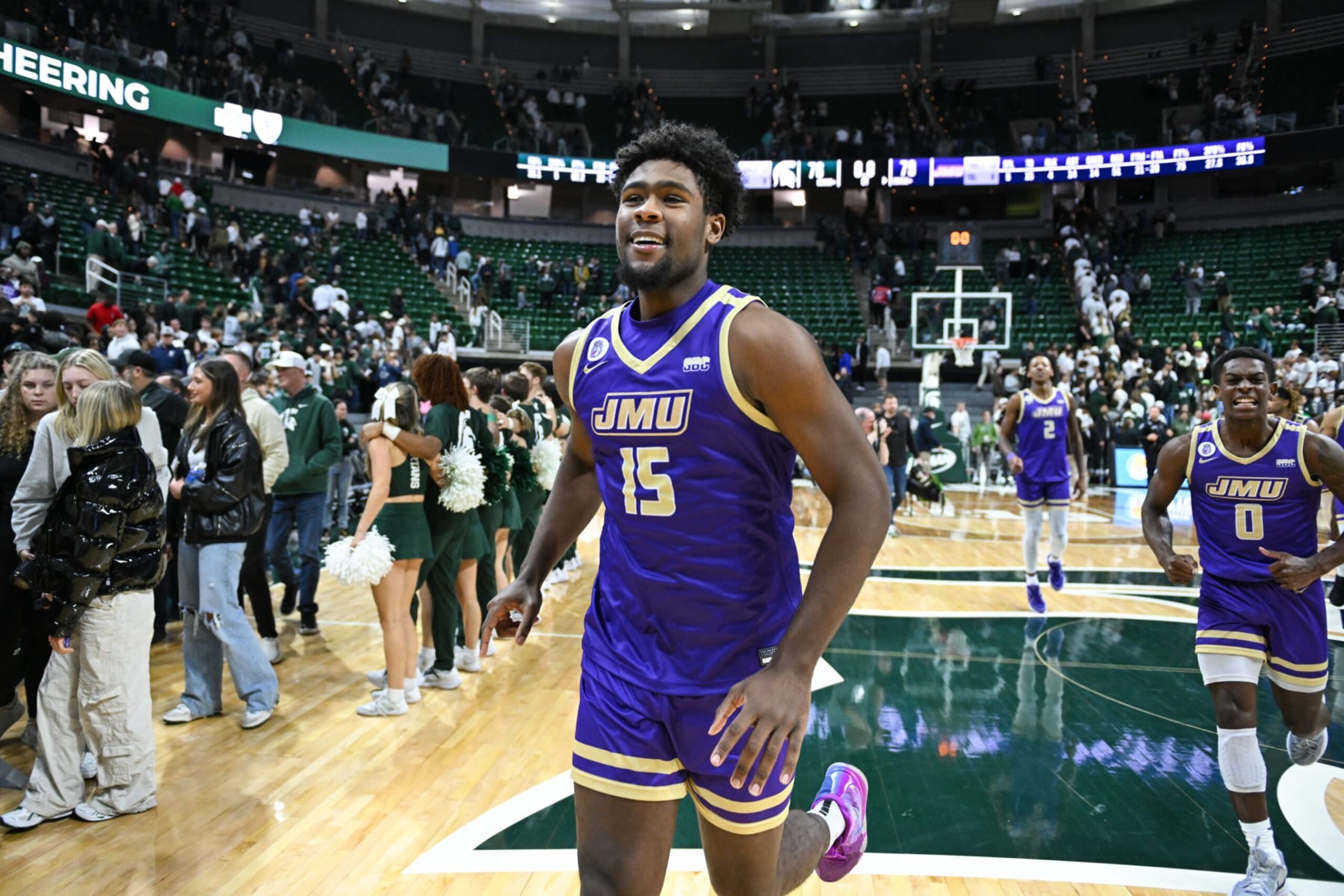 EAST LANSING, MI - NOVEMBER 06: James Madison Dukes forward Jaylen Carey (15) celebrates and upset victory following a college basketball game between the Michigan State Spartans and James Madison Dukes on November 6, 2023 at Spartan Stadium in East Lansing, MI. (Photo by Adam Ruff/Icon Sportswire via Getty Images)