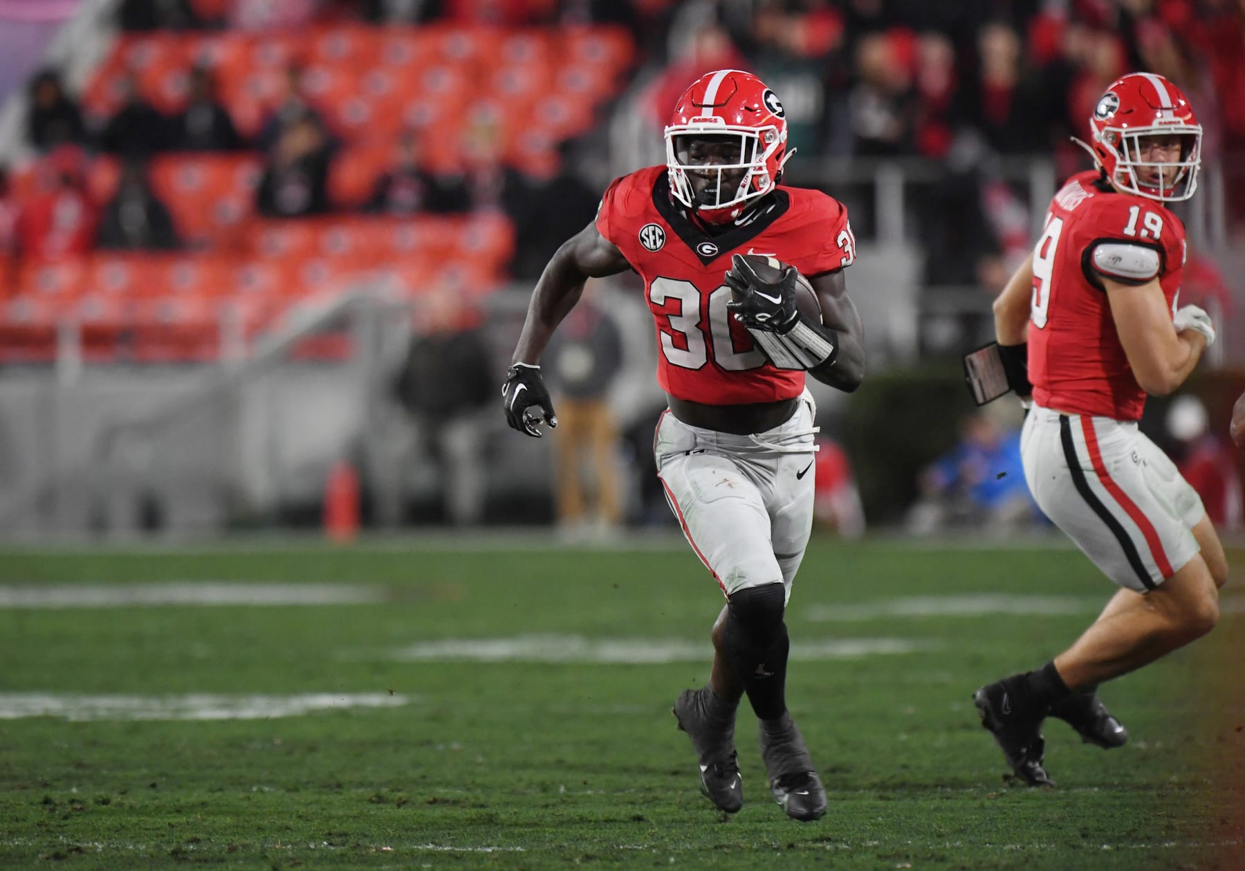 ATHENS, GA - NOVEMBER 11: Georgia Bulldogs Running Back Daijun Edwards (30) rushes the ball during the college football game between the Ole Miss Rebels and the Georgia Bulldogs on November 11, 2023, at Sanford Stadium in Athens GA. (Photo by Jeffrey Vest/Icon Sportswire via Getty Images)