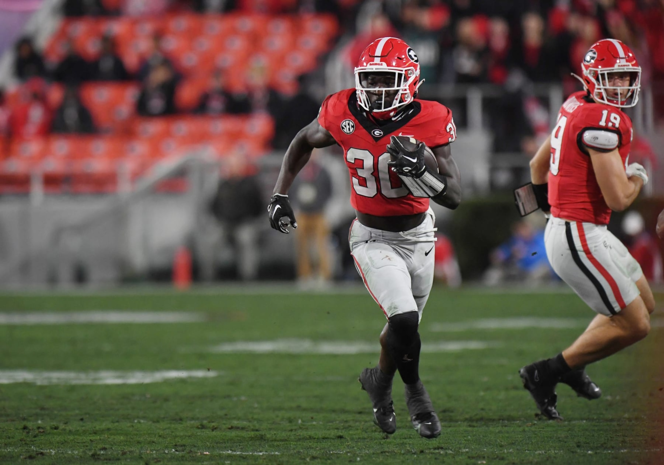 ATHENS, GA - NOVEMBER 11: Georgia Bulldogs Running Back Daijun Edwards (30) rushes the ball during the college football game between the Ole Miss Rebels and the Georgia Bulldogs on November 11, 2023, at Sanford Stadium in Athens GA. (Photo by Jeffrey Vest/Icon Sportswire via Getty Images)