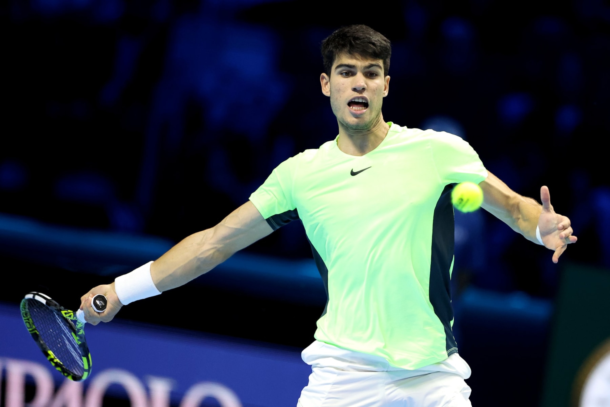 TURIN, ITALY - NOVEMBER 13: Carlos Alcaraz of Spain plays a forehand against Alexander Zverev of Germany during their Round Robin match on day two of the Nitto ATP Finals at Pala Alpitour on November 13, 2023 in Turin, Italy. (Photo by Giampiero Sposito/Getty Images)