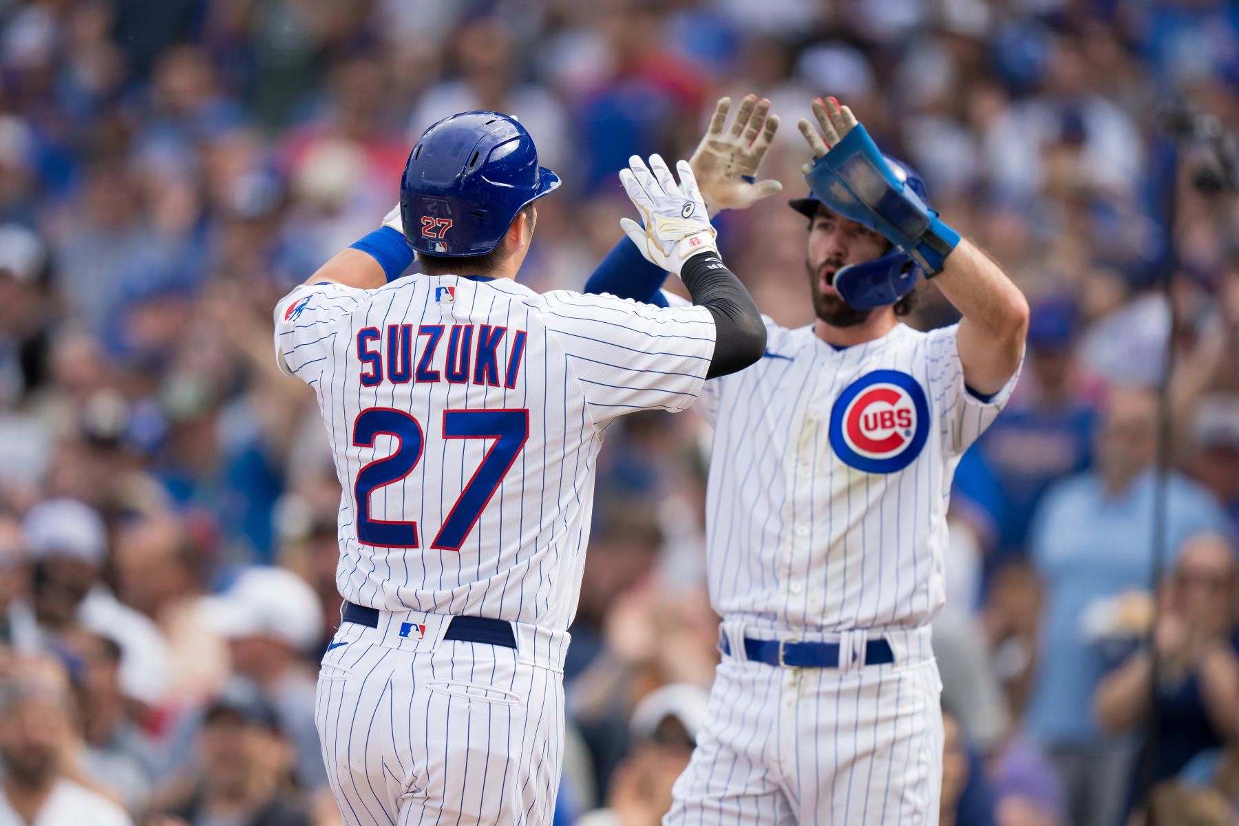 CHICAGO, IL - SEPTEMBER 22: Seiya Suzuki #27 and Dansby Swanson #7 of the Chicago Cubs celebrate a home run in a game against the Colorado Rockies at Wrigley Field on September 22, 2023 in Chicago, Illinois. (Photo by Matt Dirksen/Getty Images)