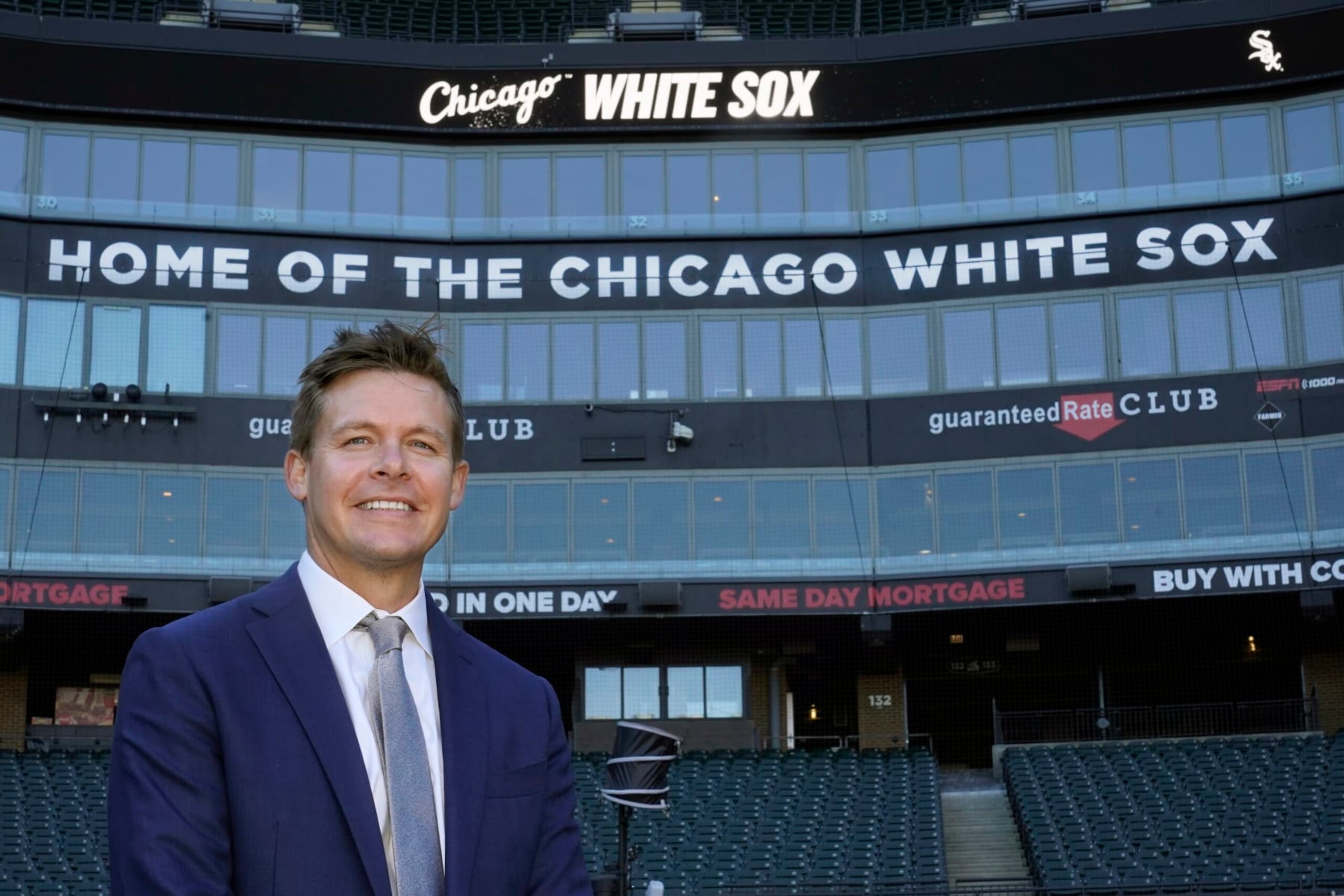 Chris Getz, newly named senior vice president/general manager of the Chicago White Sox, stands for a portrait on Guaranteed Rate Field after a baseball news conference Thursday, Aug. 31, 2023, in Chicago. Getz, a former player and front office executive with the Kansas City Royals and the White Sox, is in his seventh season with the Sox baseball operations department, including the last three as assistant general manager. (AP Photo/Charles Rex Arbogast)