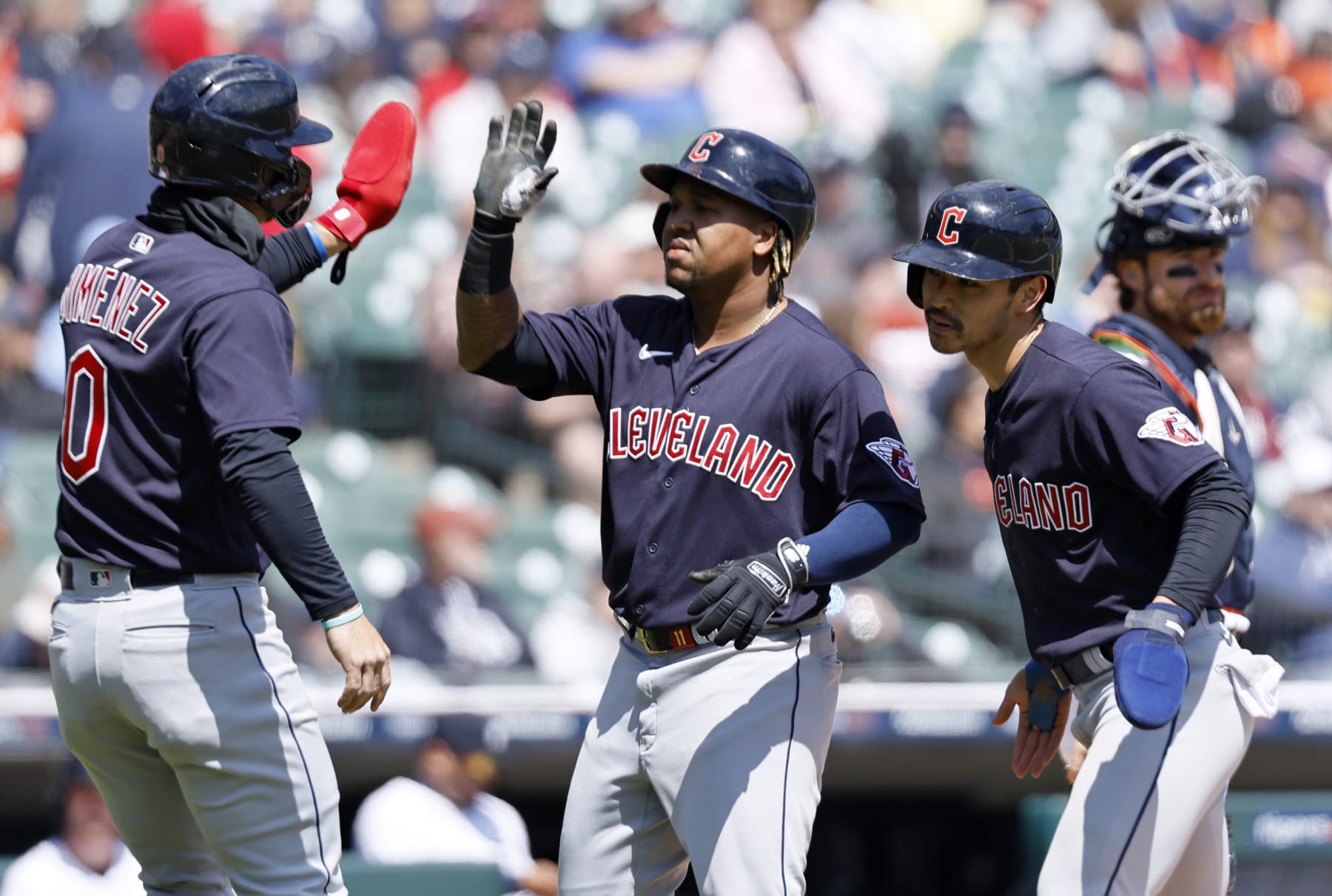 DETROIT, MI -  APRIL 19:  Jose Ramirez #11 of the Cleveland Guardians, center, celebrates with Andres Gimenez #0 and Steven Kwan #38 after hitting a three-run home run against the Detroit Tigers during the sixth inning at Comerica Park on April 19, 2023, in Detroit, Michigan. (Photo by Duane Burleson/Getty Images)