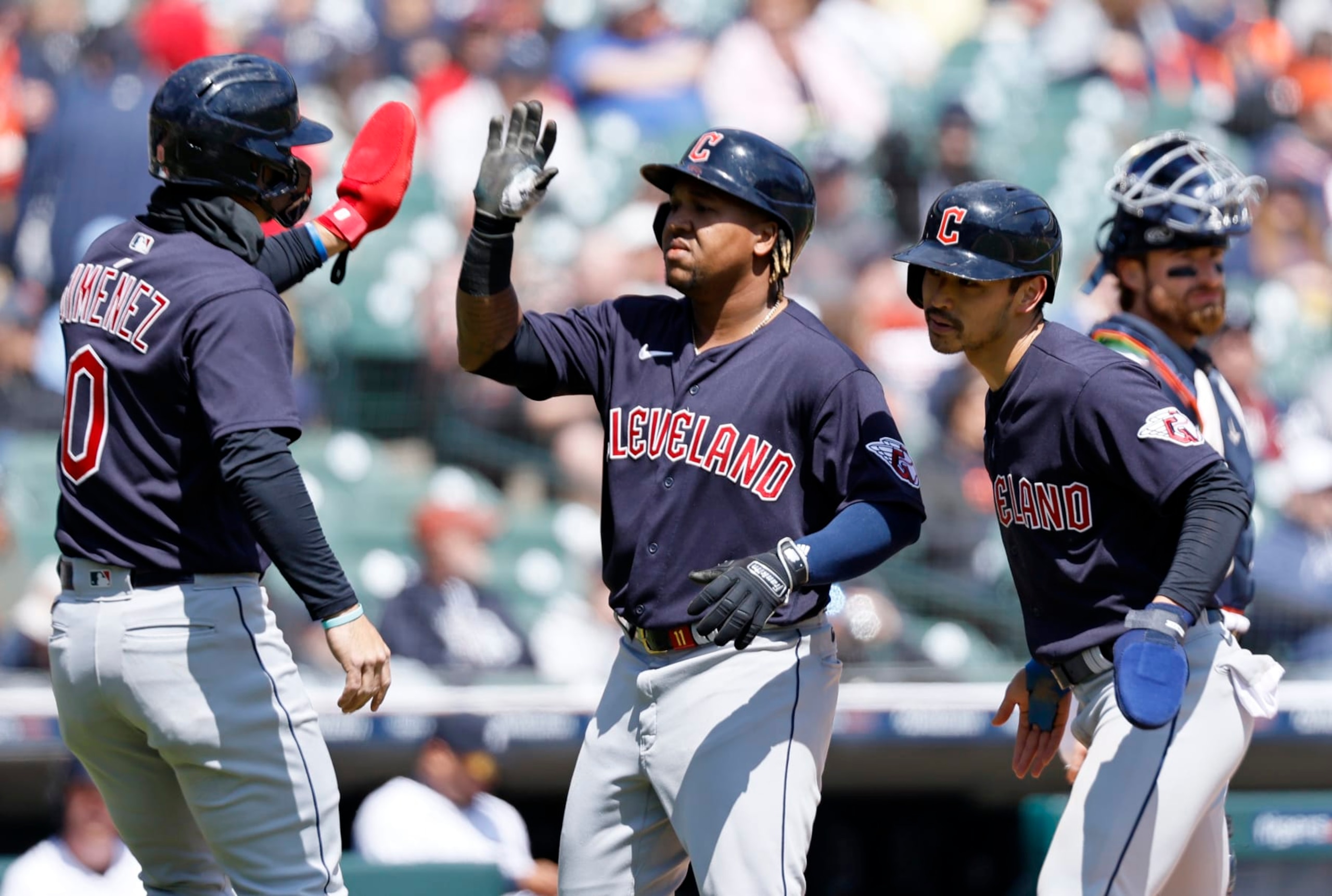 DETROIT, MI -  APRIL 19:  Jose Ramirez #11 of the Cleveland Guardians, center, celebrates with Andres Gimenez #0 and Steven Kwan #38 after hitting a three-run home run against the Detroit Tigers during the sixth inning at Comerica Park on April 19, 2023, in Detroit, Michigan. (Photo by Duane Burleson/Getty Images)