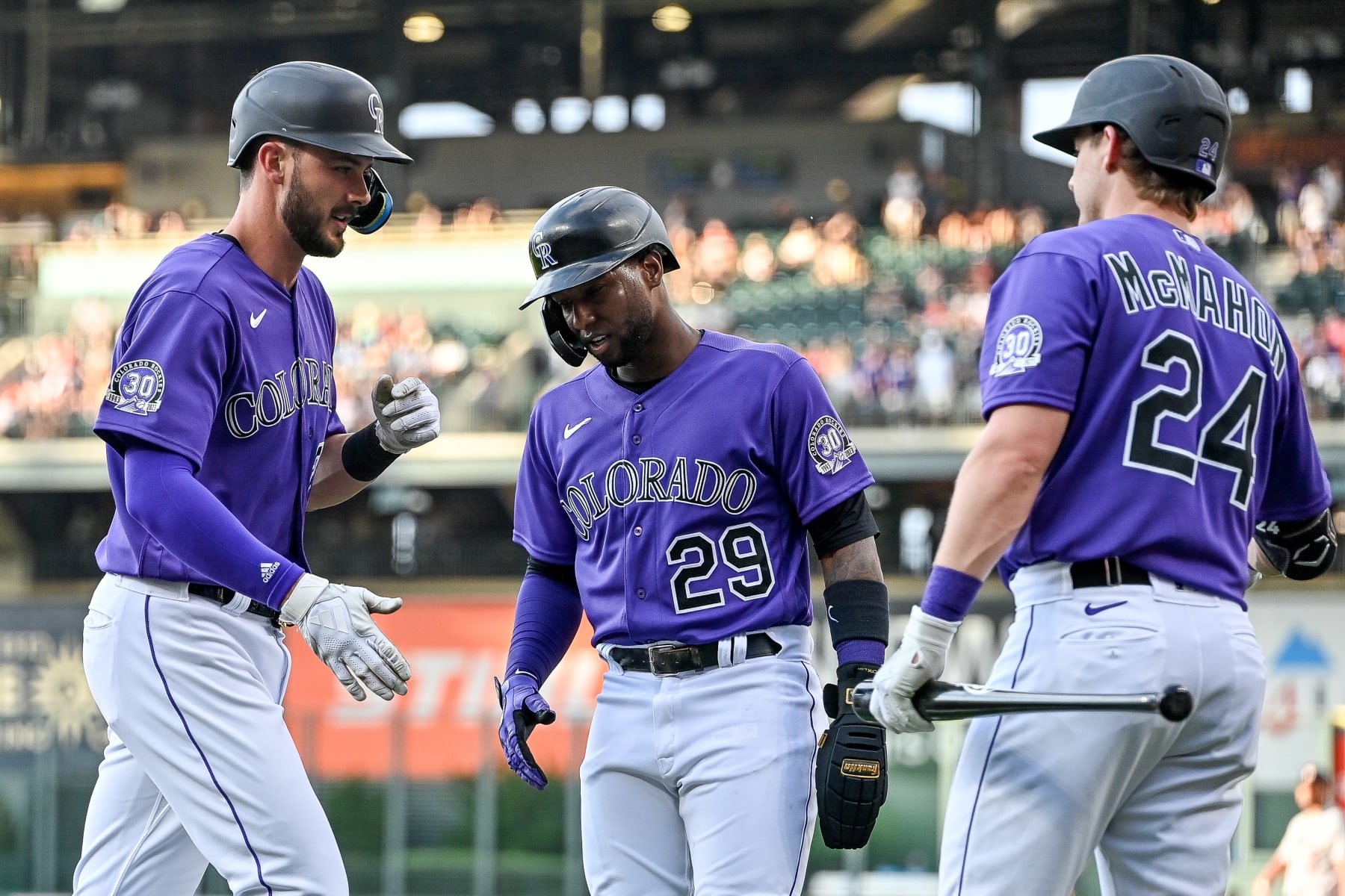 DENVER, CO - JULY 18: Colorado Rockies right fielder Kris Bryant (23) celebrates with left fielder Jurickson Profar (29) and Ryan McMahon after hitting a first inning two-run home run during an interleague game between the Houston Astros and the Colorado Rockies at Coors Field on July 18, 2023 in Denver, Colorado. (Photo by Dustin Bradford/Icon Sportswire via Getty Images)
