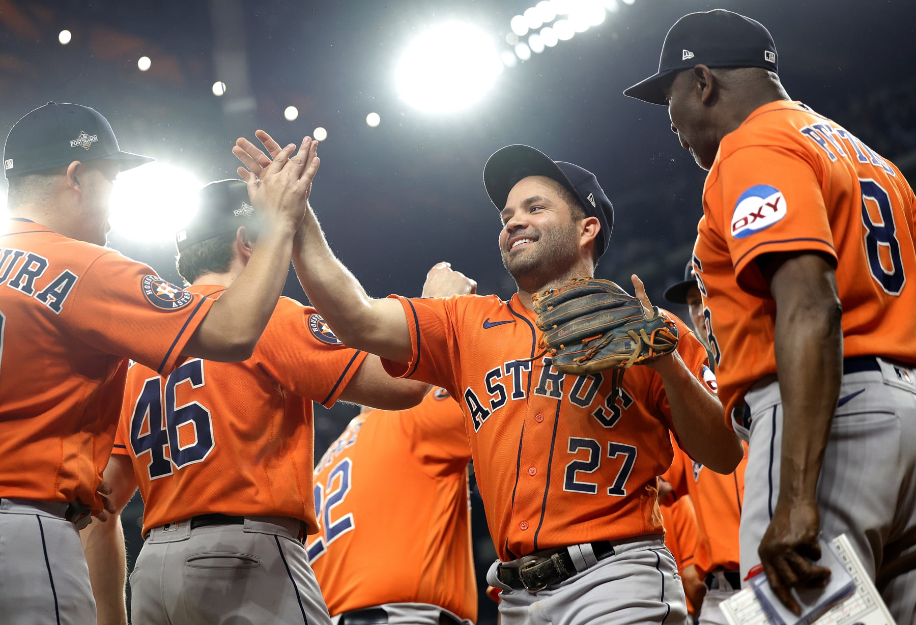 ARLINGTON, TEXAS - OCTOBER 20: Jose Altuve #27 of the Houston Astros celebrates with his teammates after defeating the Texas Rangers in Game Five of the American League Championship Series at Globe Life Field on October 20, 2023 in Arlington, Texas. (Photo by Carmen Mandato/Getty Images)