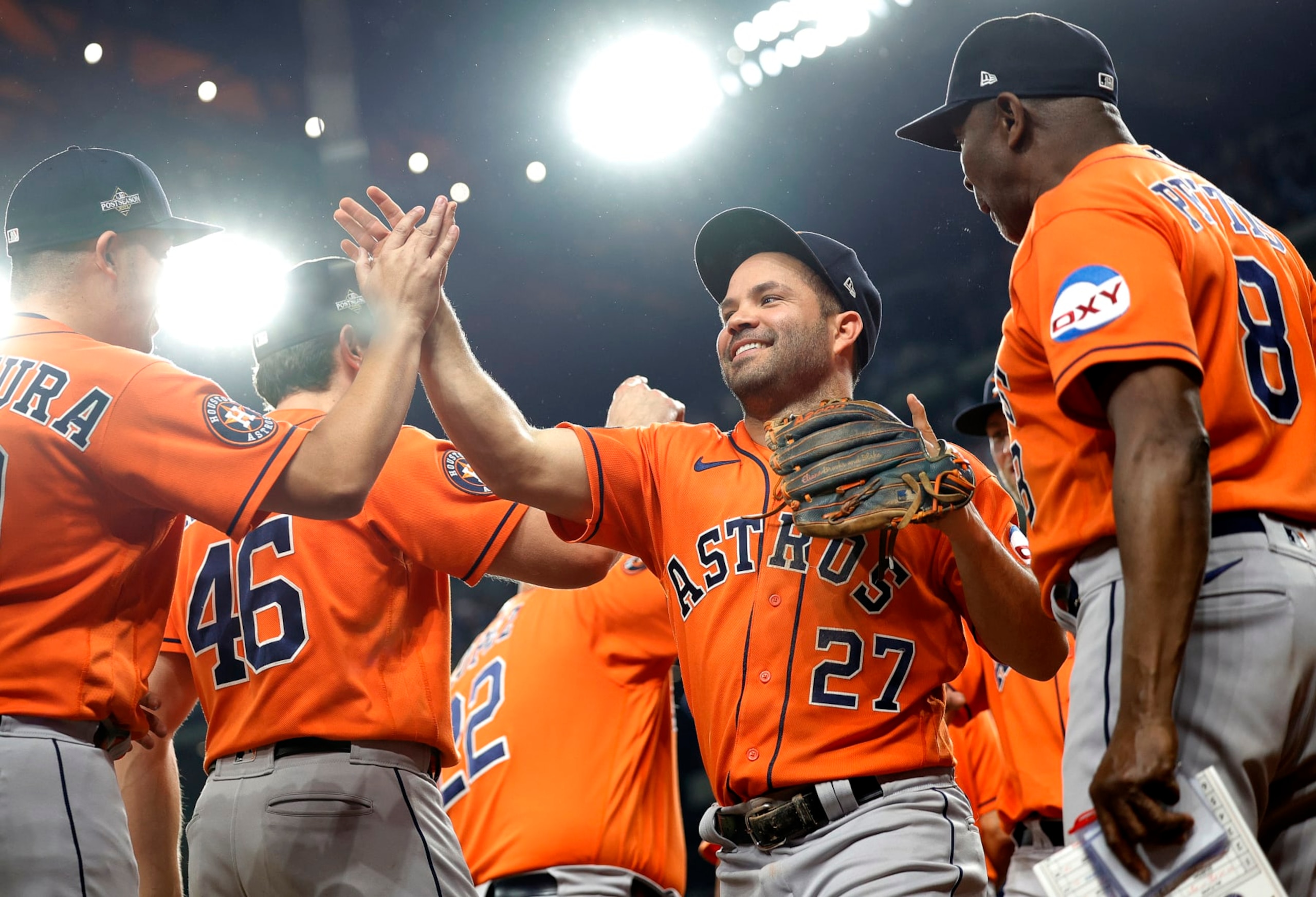 ARLINGTON, TEXAS - OCTOBER 20: Jose Altuve #27 of the Houston Astros celebrates with his teammates after defeating the Texas Rangers in Game Five of the American League Championship Series at Globe Life Field on October 20, 2023 in Arlington, Texas. (Photo by Carmen Mandato/Getty Images)