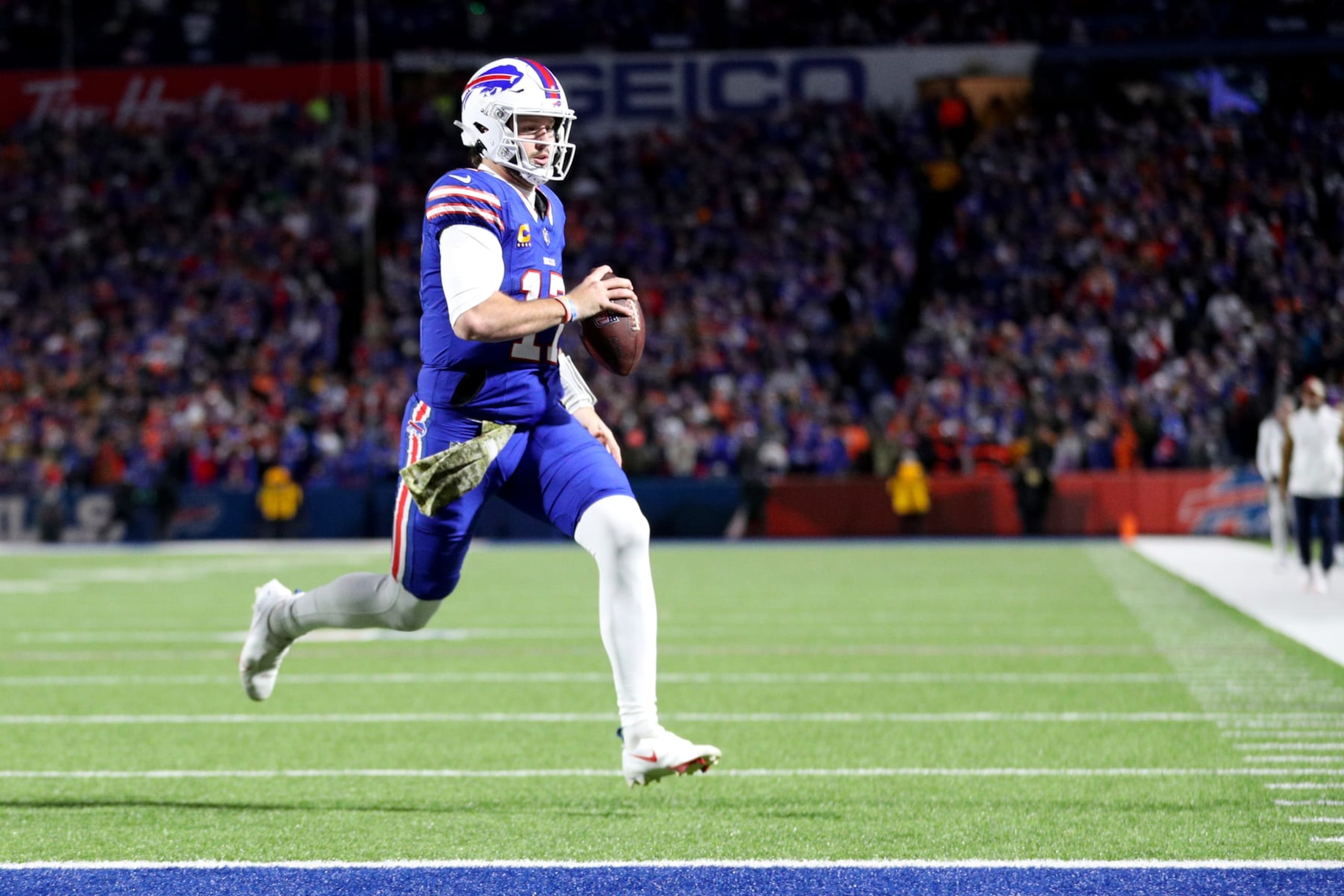 ORCHARD PARK, NEW YORK - NOVEMBER 13: Josh Allen #17 of the Buffalo Bills rushes for a touchdown against the Denver Broncos during the fourth quarter at Highmark Stadium on November 13, 2023 in Orchard Park, New York. (Photo by Bryan M. Bennett/Getty Images)