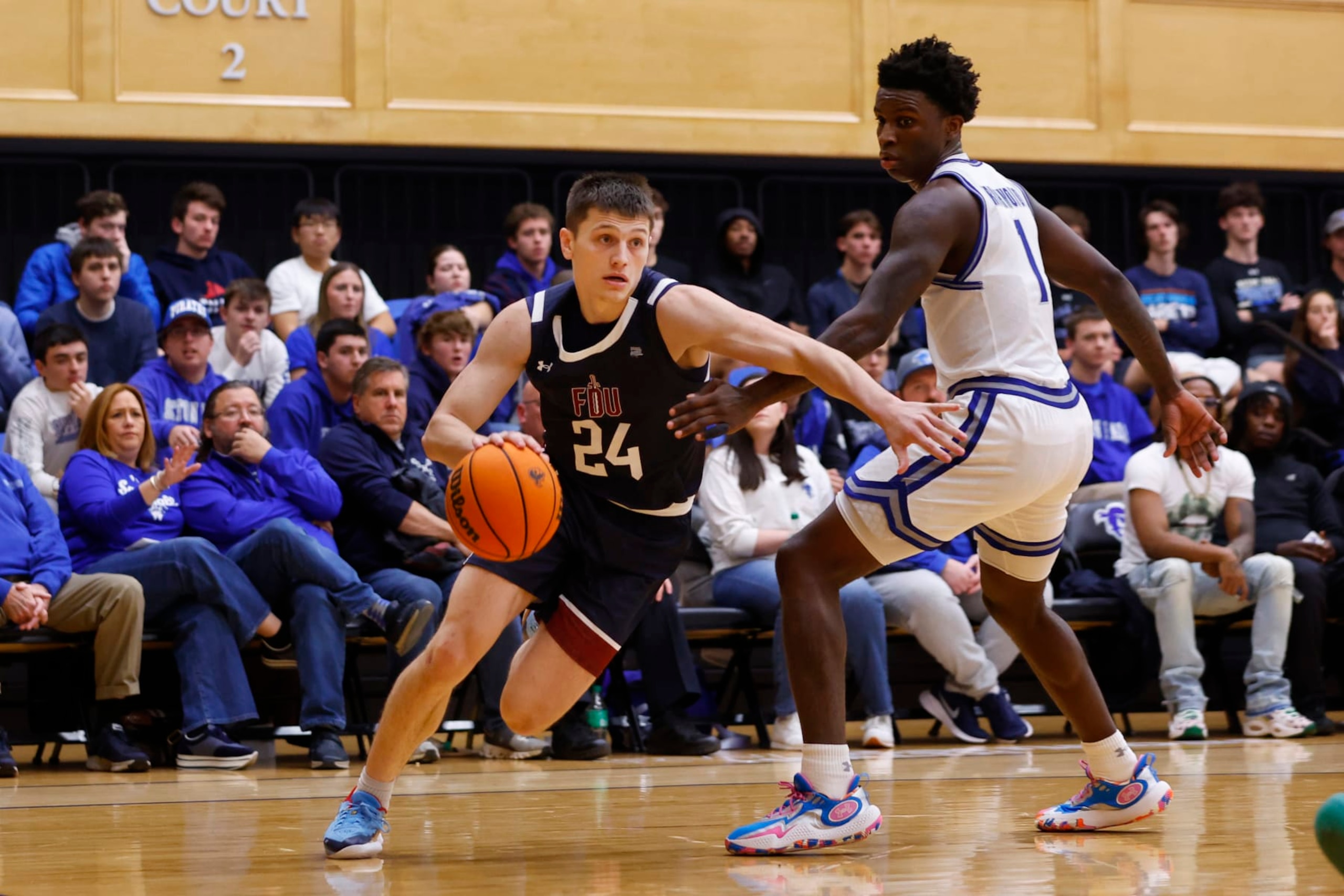 SOUTH ORANGE, NEW JERSEY - NOVEMBER 11: Brayden Reynolds #24 of the Fairleigh Dickinson Knights in action against Kadary Richmond #1 of the Seton Hall Pirates during a game at Walsh Gym on November 11, 2023 in South Orange, New Jersey. Seton Hall defeated FDU 85-55. (Photo by Rich Schultz/Getty Images)