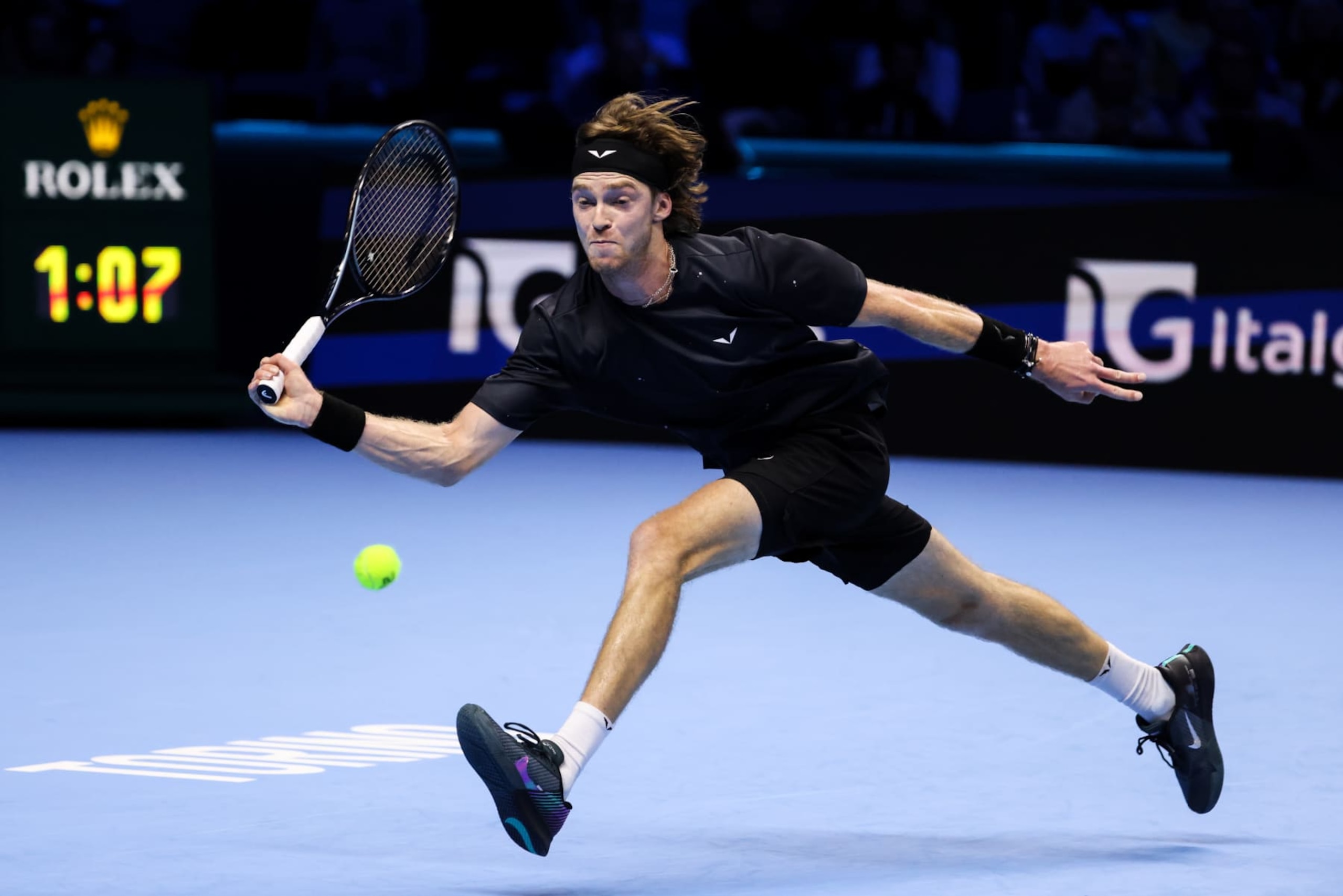 TURIN, ITALY - NOVEMBER 13: Andrey Rublev plays a forehand in the Men's Singles Round Robin match against Daniil Medvedev during day two of the Nitto ATP Finals at Pala Alpitour on November 13, 2023 in Turin, Italy. (Photo by Shi Tang/Getty Images)