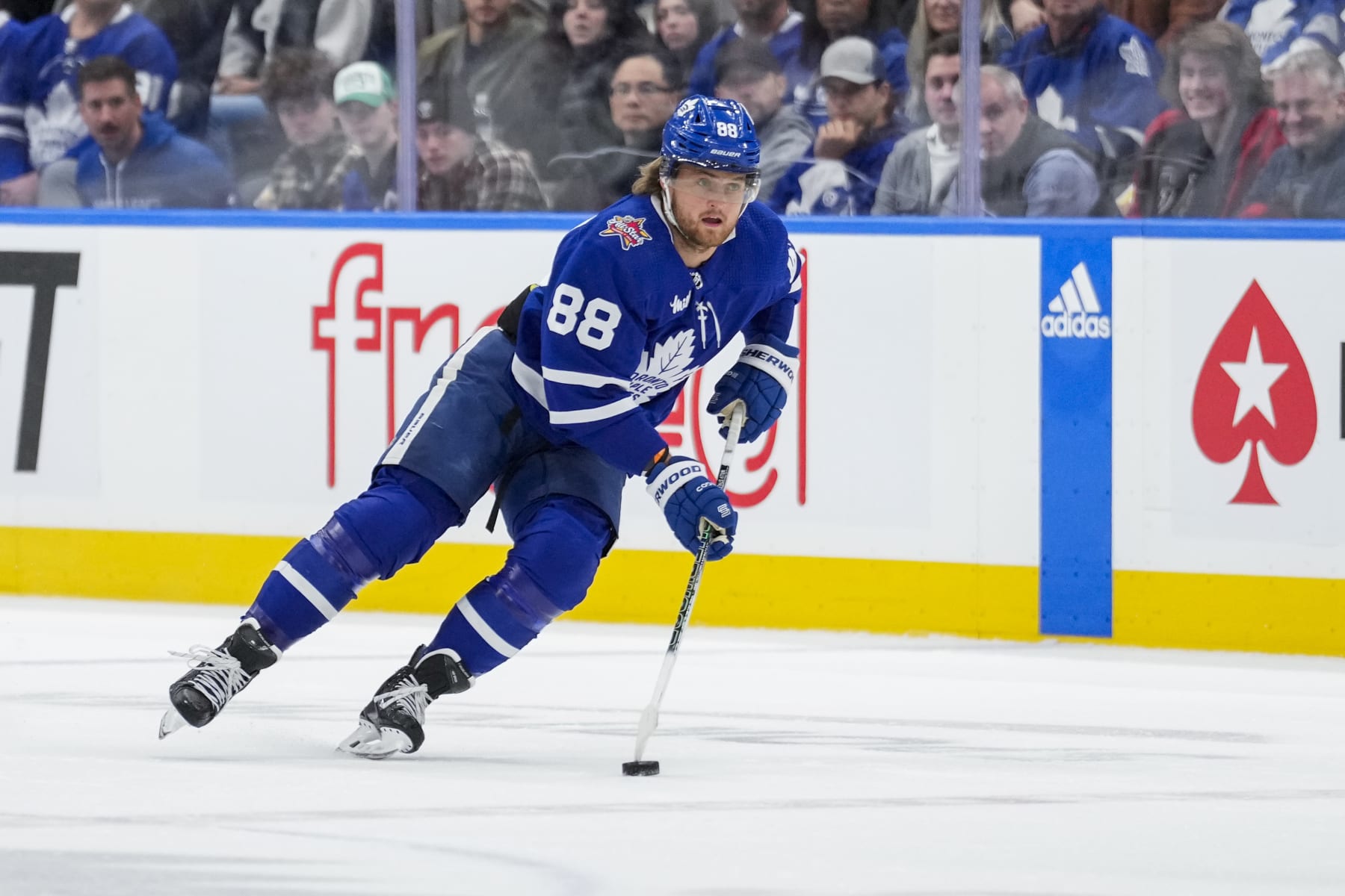 TORONTO, ON - NOVEMBER 11: William Nylander #88 of the Toronto Maple Leafs plays the puck against the Vancouver Canucks during the first period at the Scotiabank Arena on November 11, 2023 in Toronto, Ontario, Canada. (Photo by Andrew Lahodynskyj/NHLI via Getty Images)