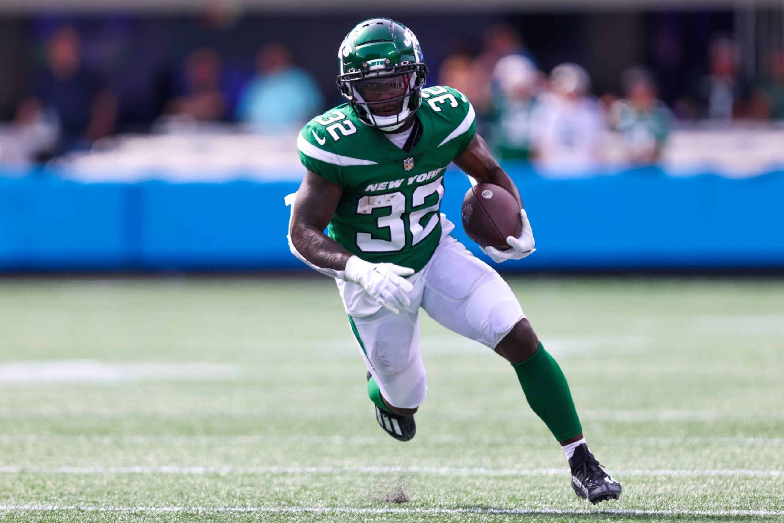 CHARLOTTE, NC - AUGUST 12: Michael Carter #32 of the New York Jets runs the ball during an NFL preseason game against the Carolina Panthers at Bank of America Stadium in Charlotte, North Carolina, on Aug 12, 2023. (Photo by David Jensen/Icon Sportswire via Getty Images)