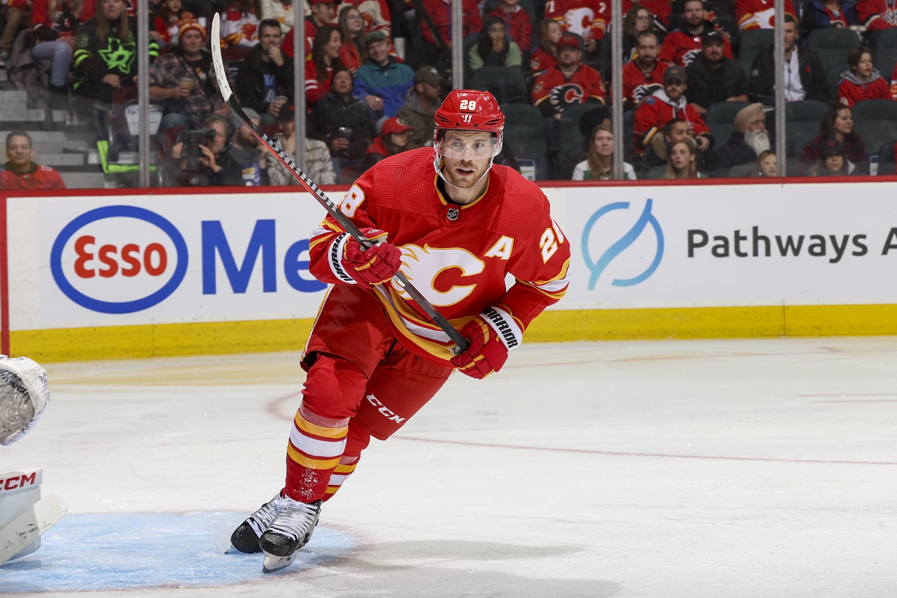 CALGARY, AB - NOVEMBER 1: Elias Lindholm #28 of the Calgary Flames skates up ice against the Dallas Stars at Scotiabank Saddledome on November 1, 2023 in Calgary, Alberta, Canada. (Photo by Gerry Thomas/NHLI via Getty Images)