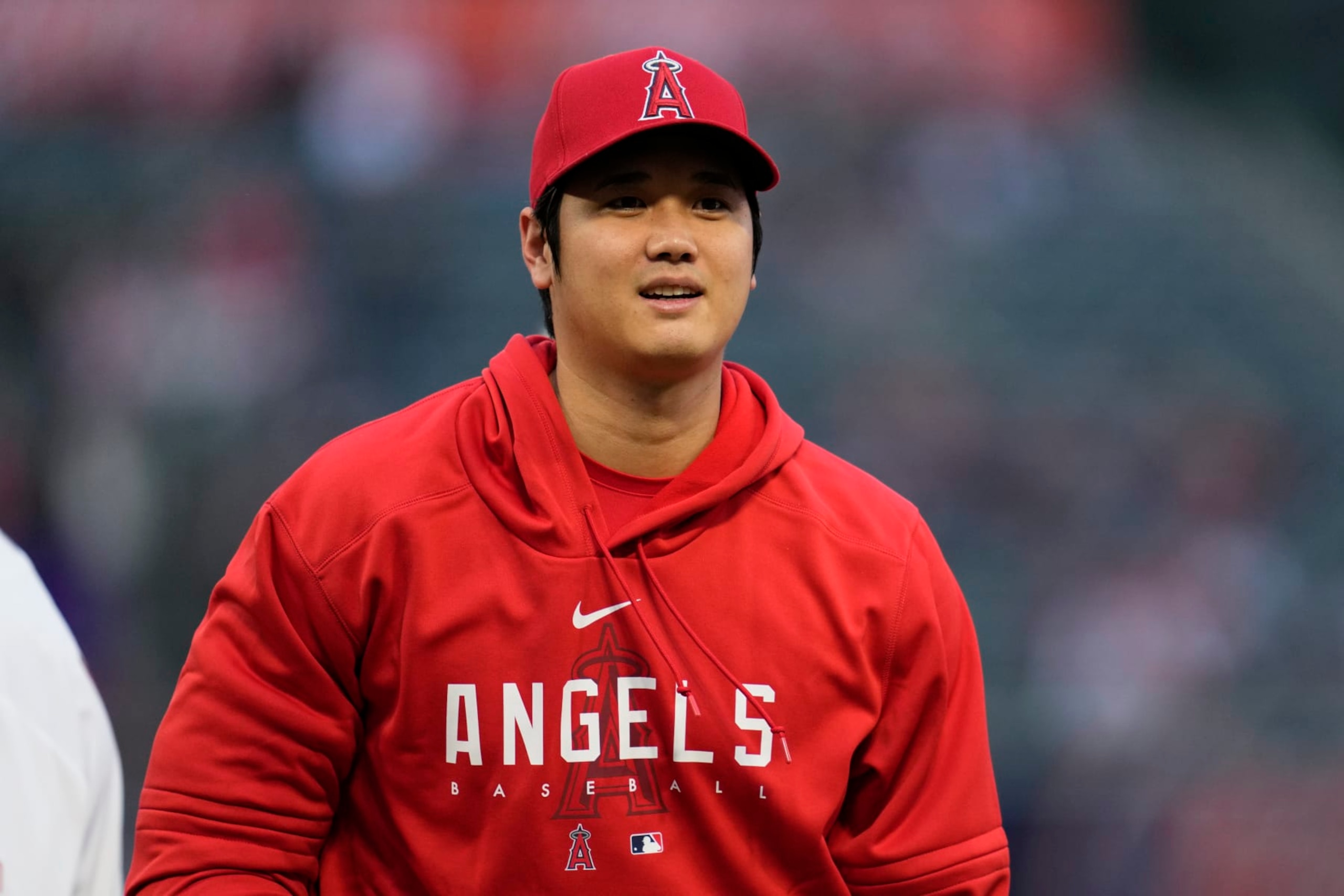 Los Angeles Angels' Shohei Ohtani greets Angel Stadium employees before accepting the team's Most Valuable Player Award before a baseball game against the Oakland Athletics in Anaheim, Calif., Saturday, Sept. 30, 2023. (AP Photo/Ashley Landis)