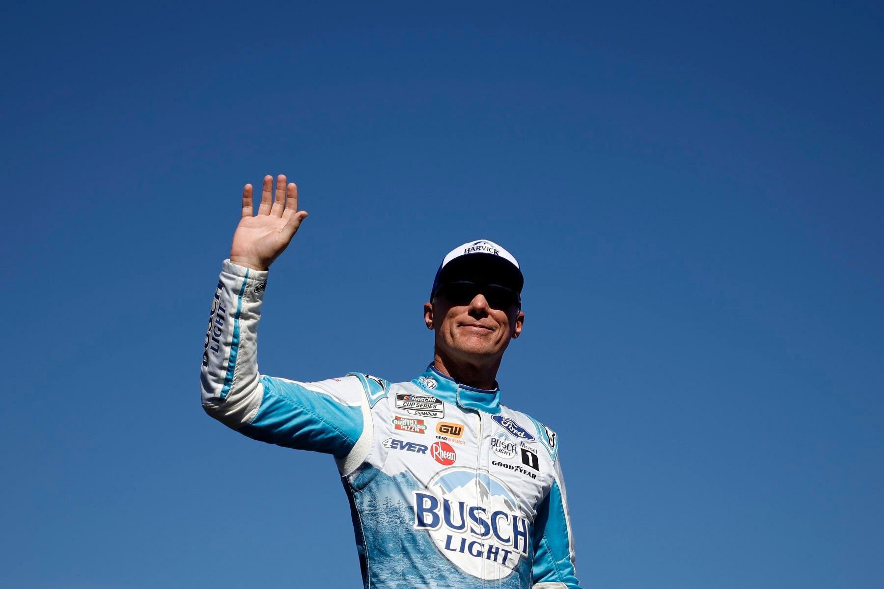 AVONDALE, ARIZONA - NOVEMBER 05: Kevin Harvick, driver of the #4 Busch Light Harvick Ford, waves to fans as he walks onstage during driver intros prior to the NASCAR Cup Series Championship at Phoenix Raceway on November 05, 2023 in Avondale, Arizona. (Photo by James Gilbert/Getty Images)